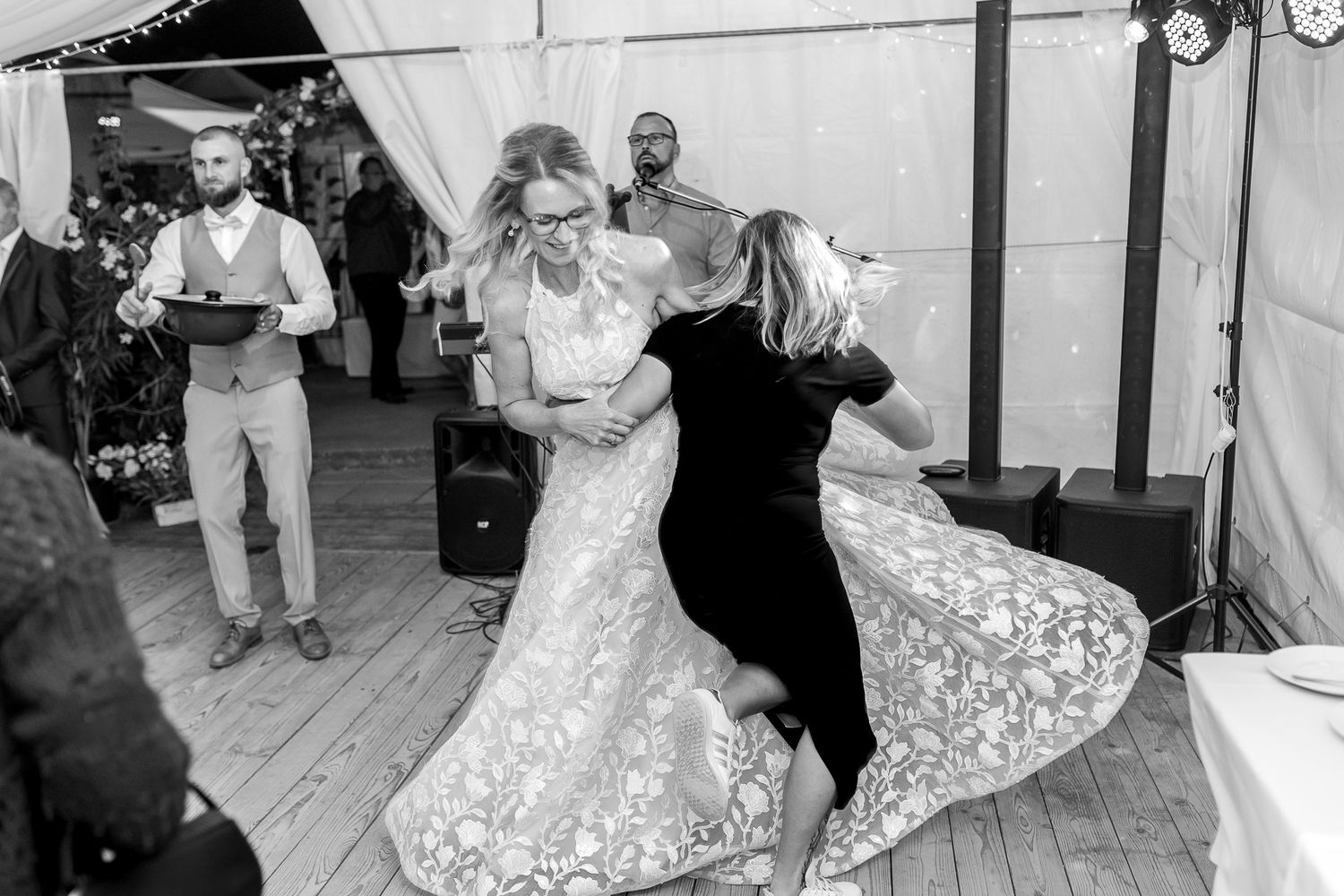 A black and white photo montage of a wedding celebration showing dancing and joyful moments on the dance floor.