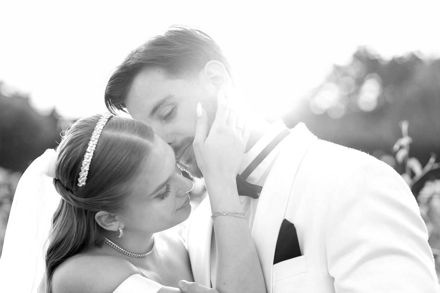 Romantic black and white wedding portraits showing intimate moments between newlyweds.