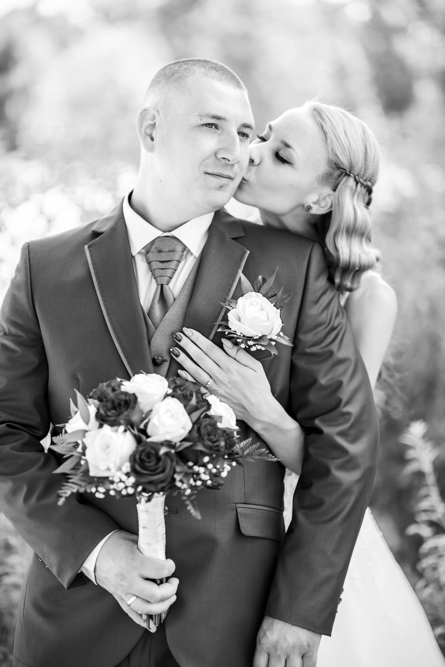 Black and white wedding photo sequence showing romantic candid moments between newlyweds with white floral bouquet.