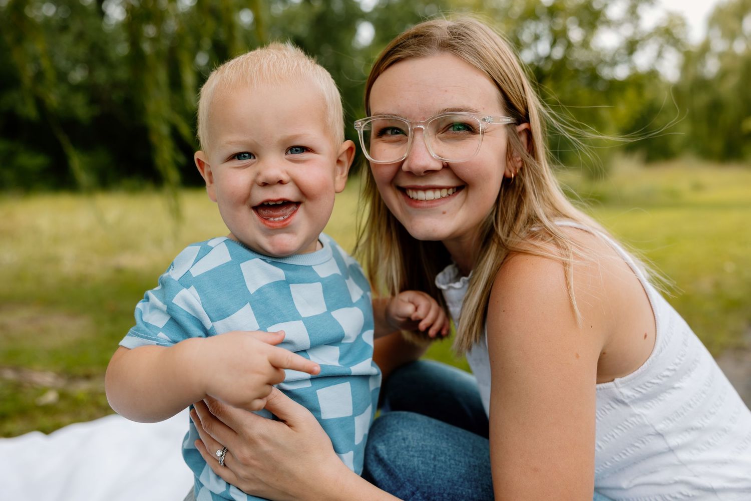 A series of outdoor family portraits showing joyful moments between parent and child in a natural setting.
