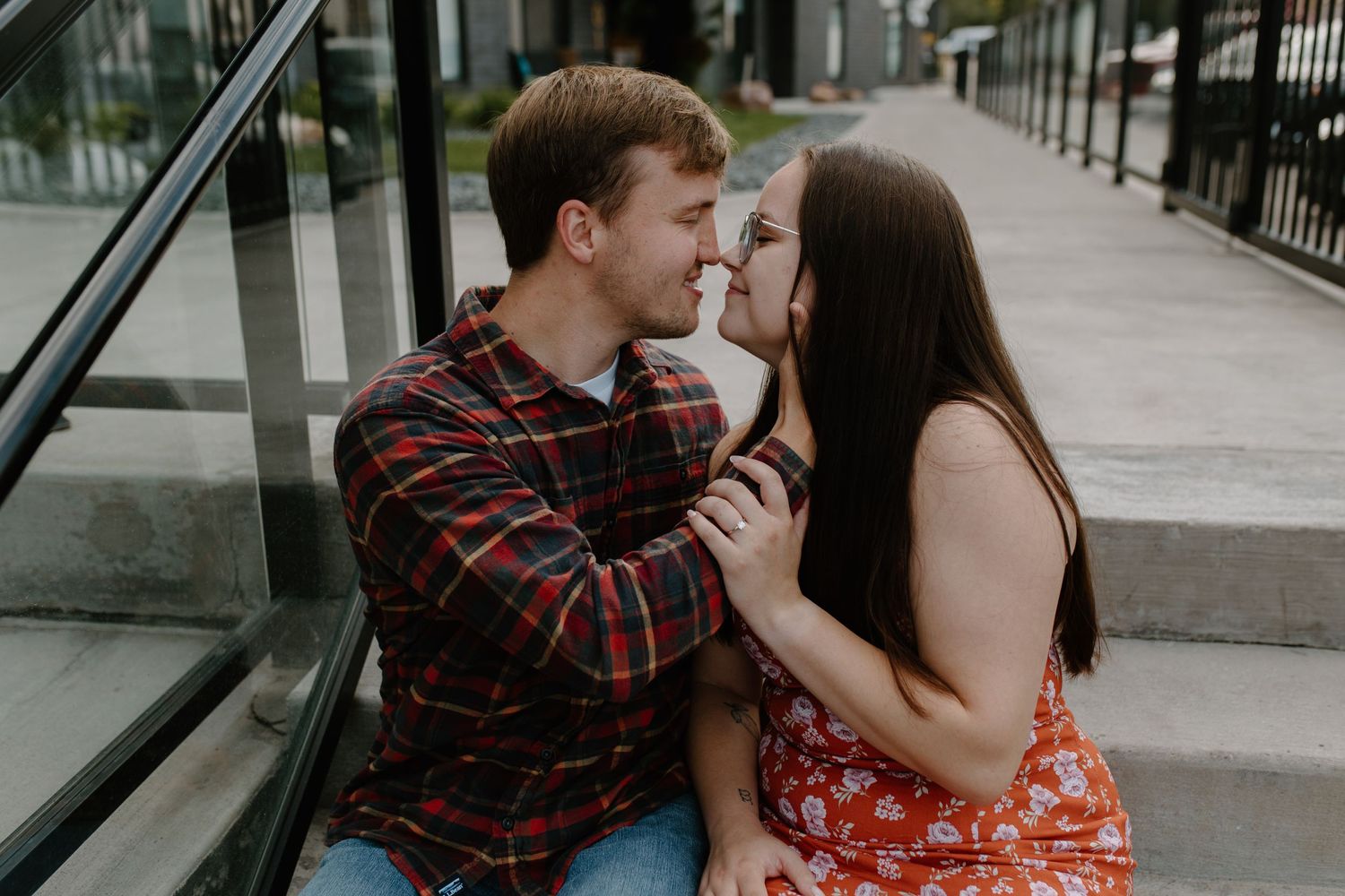 Couple shares intimate moment while sitting on urban steps.
Sioux Falls Photographer  
Evermore Photo Co
