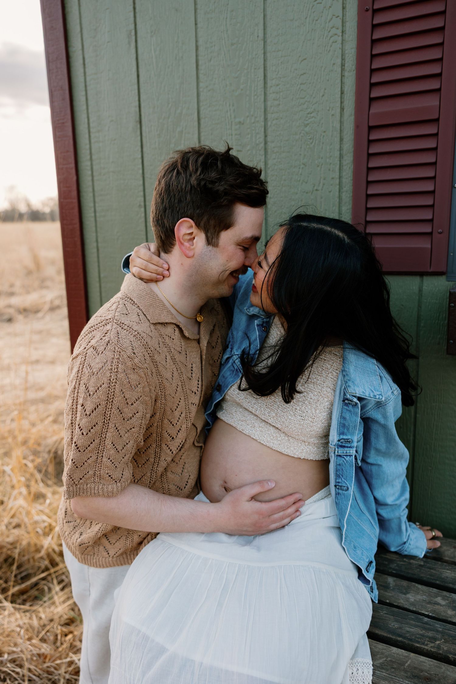 A romantic couple in casual attire sharing tender moments in a series of four intimate photographs.