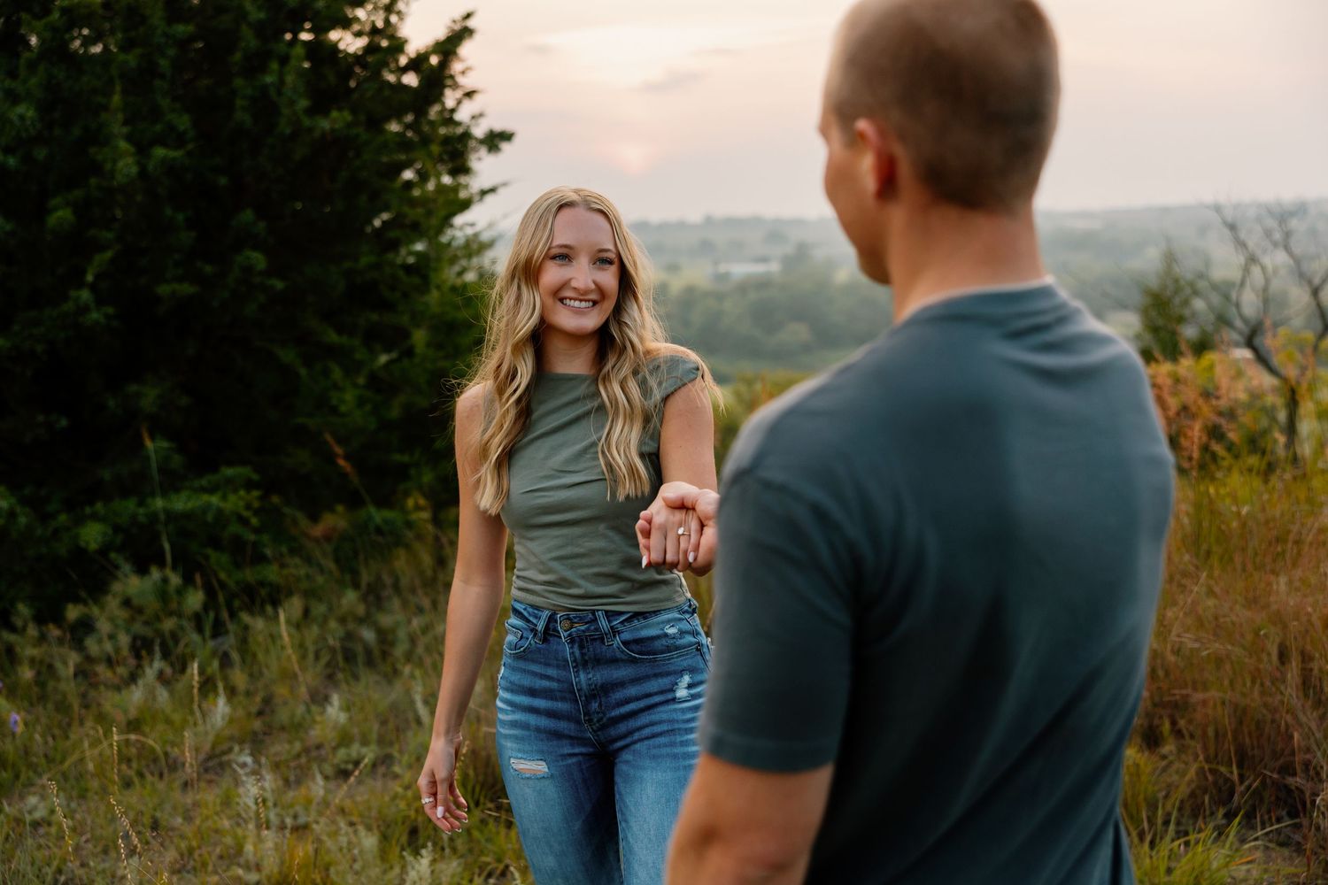 Couple sharing joyful moment together in outdoor setting with natural lighting. sioux falls photographer riley ro photo
