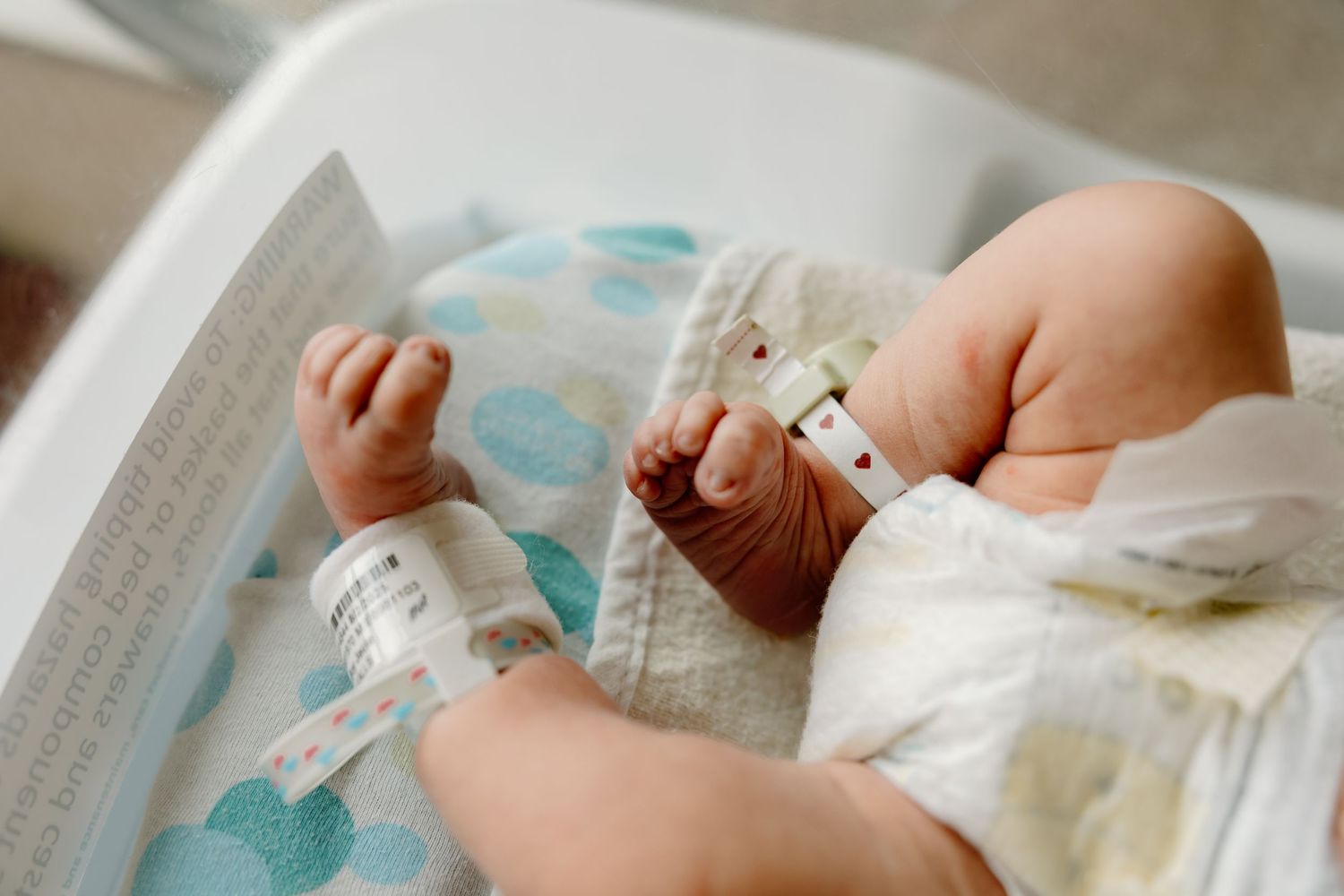 Changing a newborn's diaper with gentle care and attention.