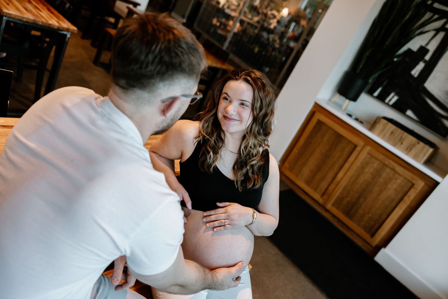 A series of intimate wedding photos showing tender moments between a couple in a rustic indoor setting. Riley Ro Photo Sioux Falls, SD