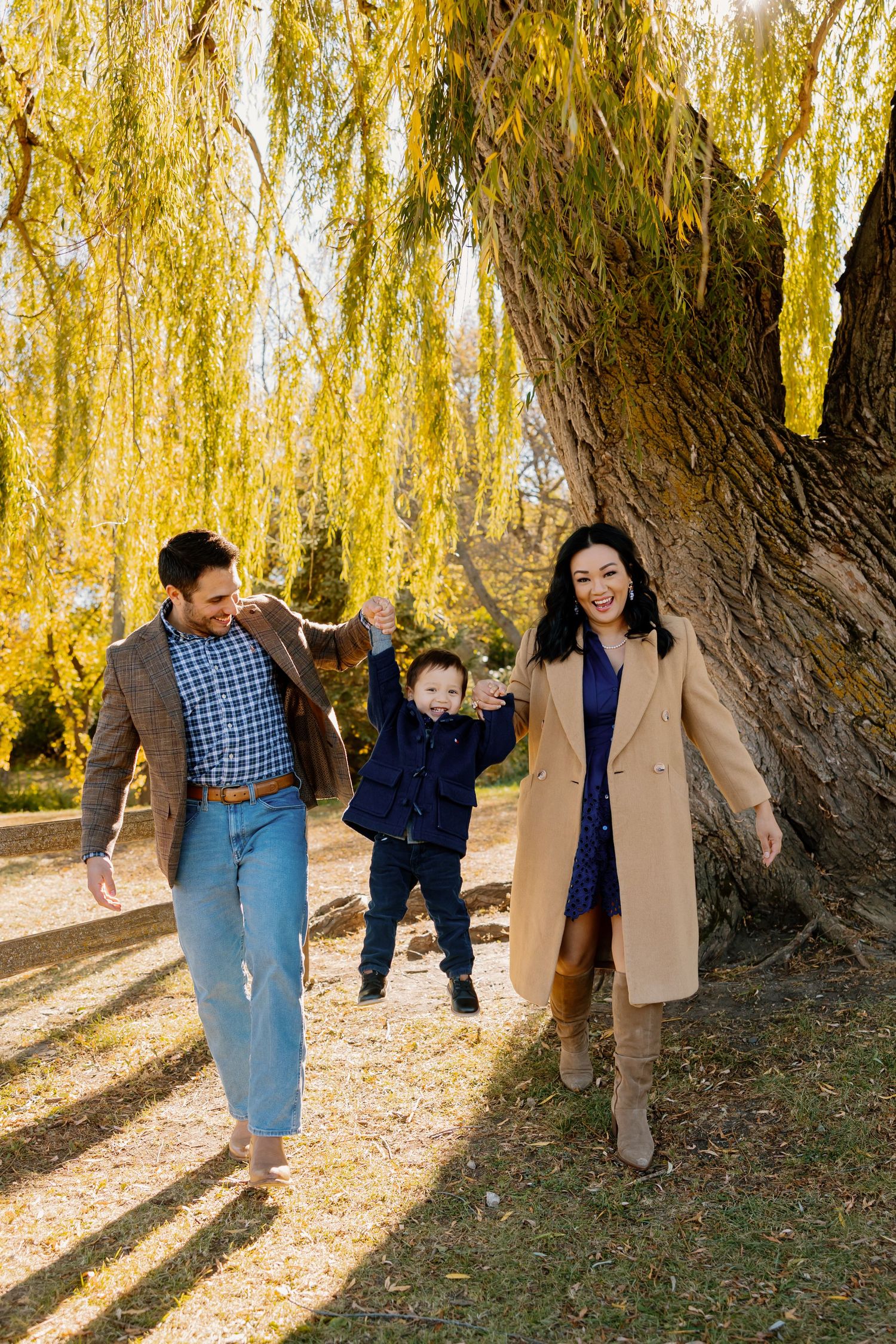 A sequence of photos showing a playful moment under willow trees in autumn with fallen yellow leaves.