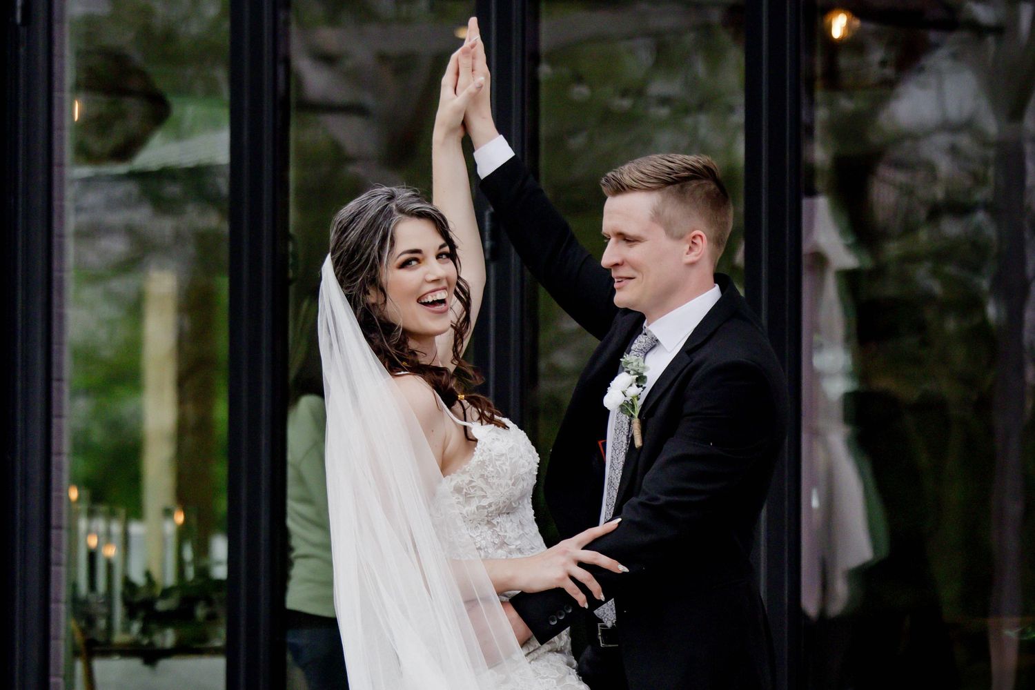 Wedding couple performs a dramatic dance dip on their special day.