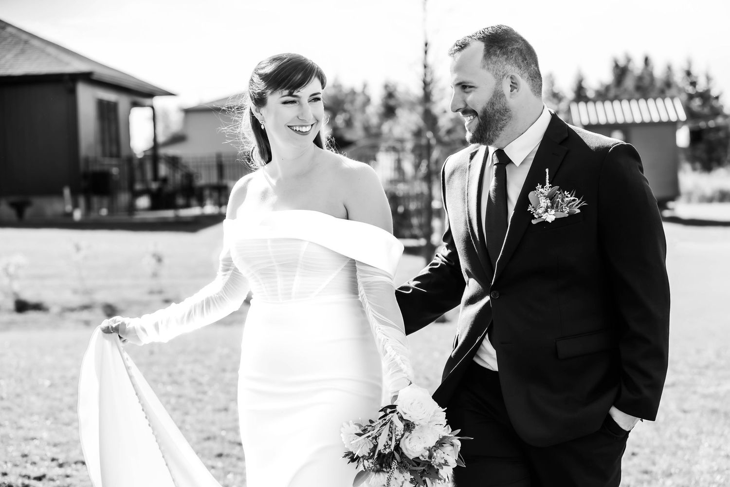 Romantic black and white wedding portraits captured in natural outdoor setting.