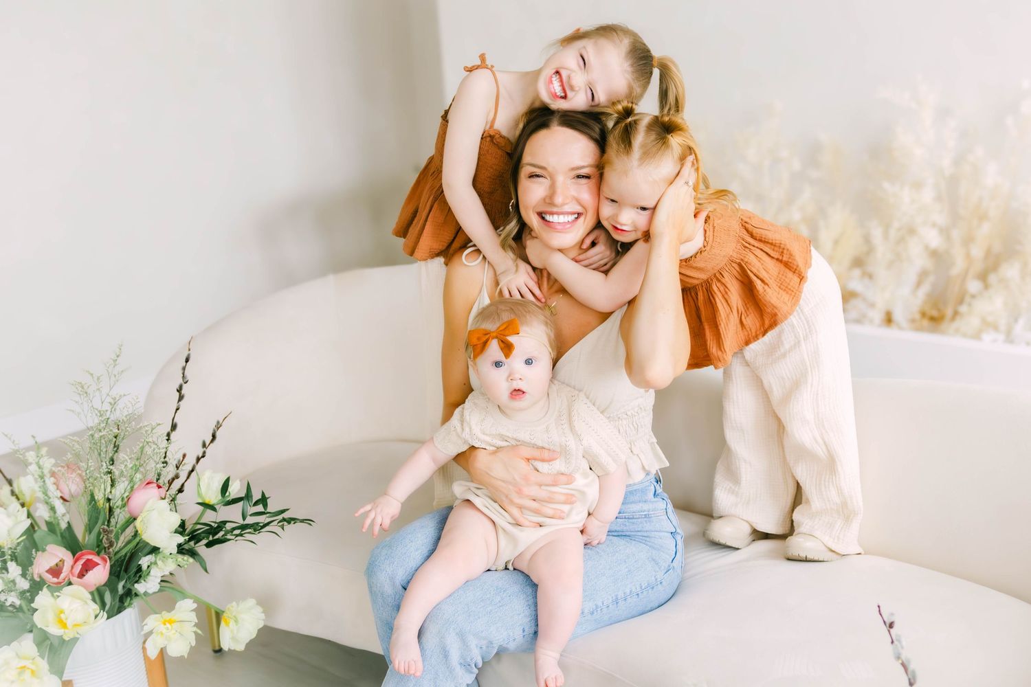 Casual lifestyle photography featuring soft lighting and natural moments in a studio setting.
