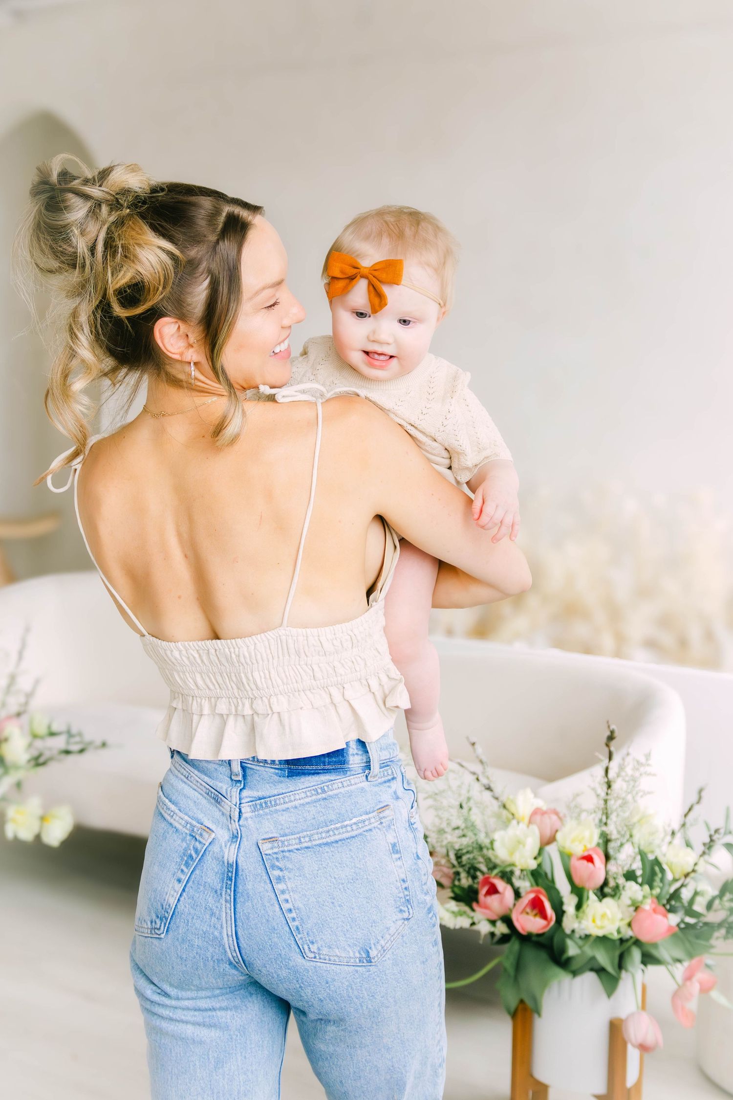 A collection of candid lifestyle photos showing tender moments with light denim and floral arrangements.