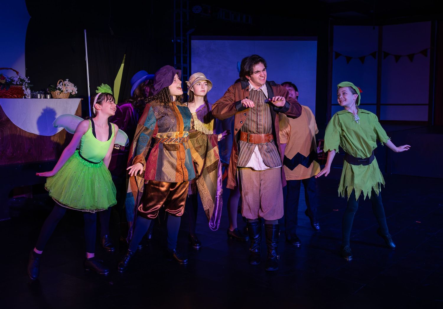 Ensemble cast performing on stage in Redmond