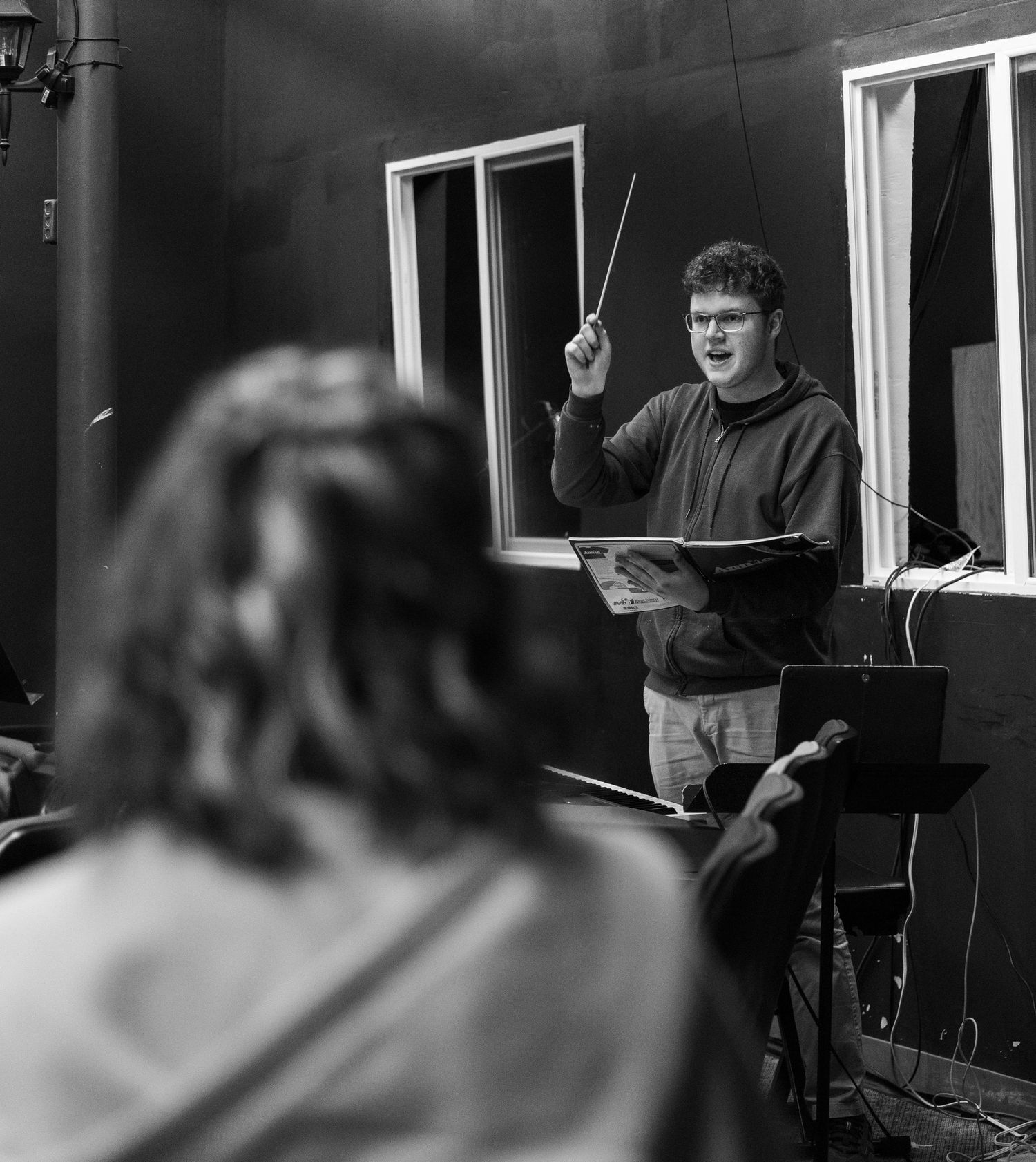 Music Director conducting music for theatre production in Kirkland.
