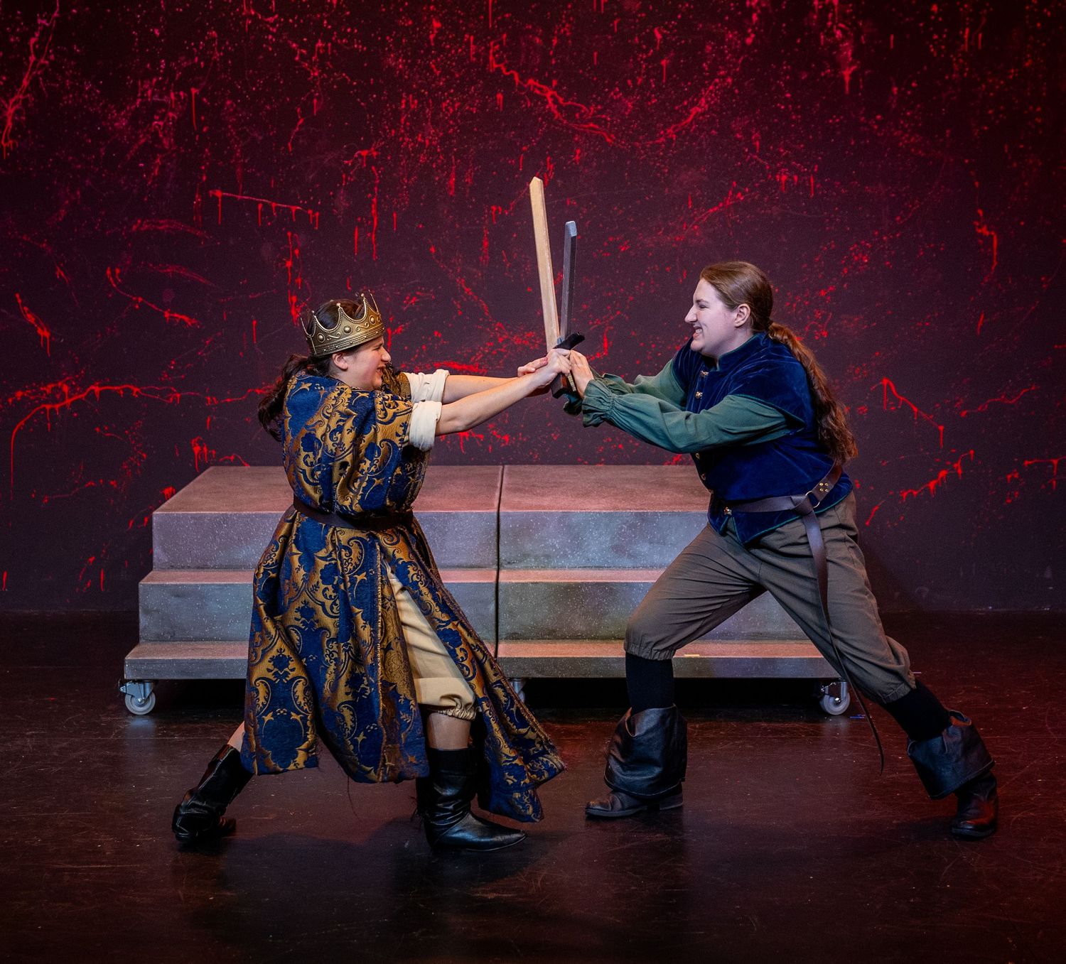 Actors engaging in stage combat during performance in Kirkland theatre