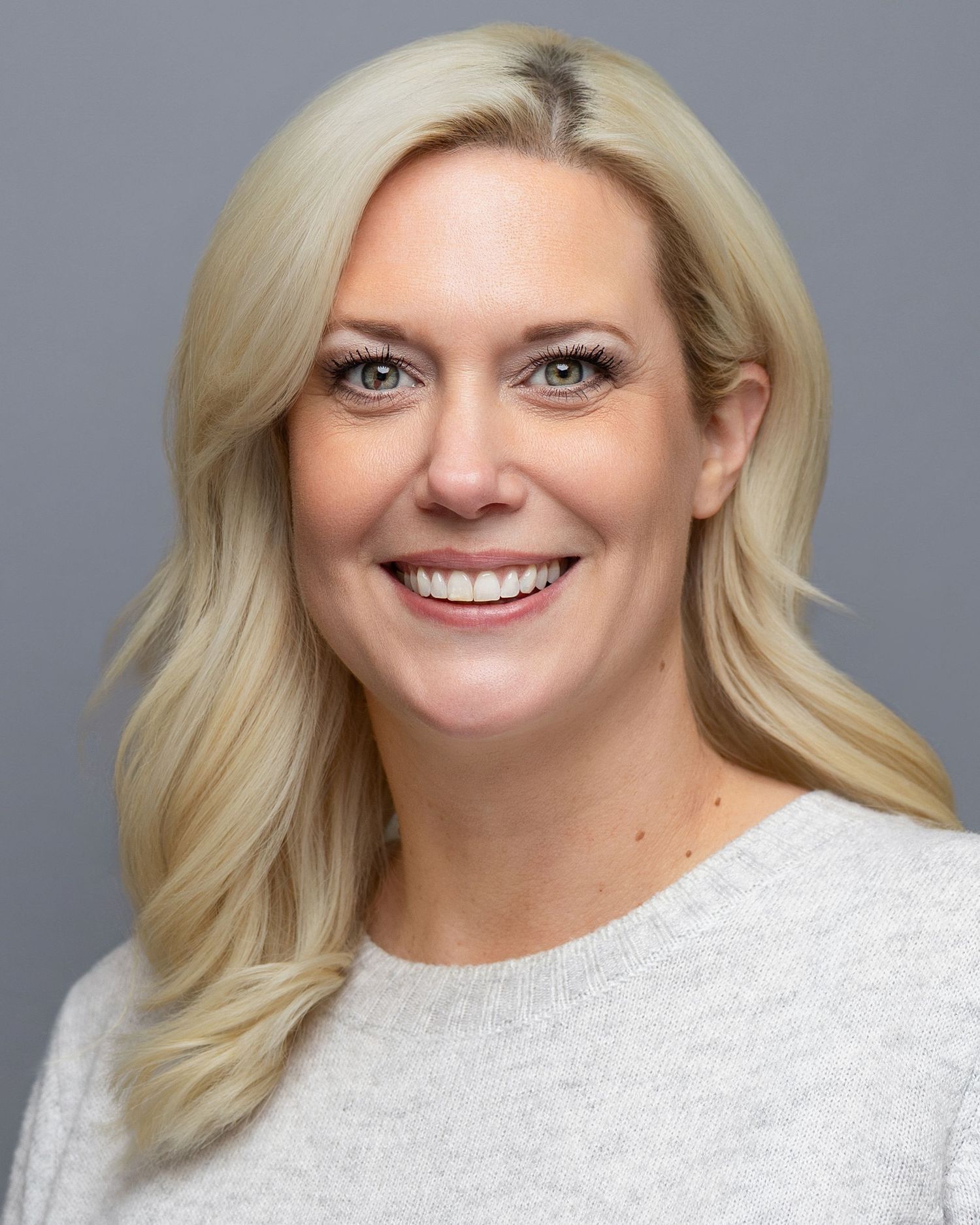 Relaxed, authentic headshot of a corporate employee photographed in Redmond