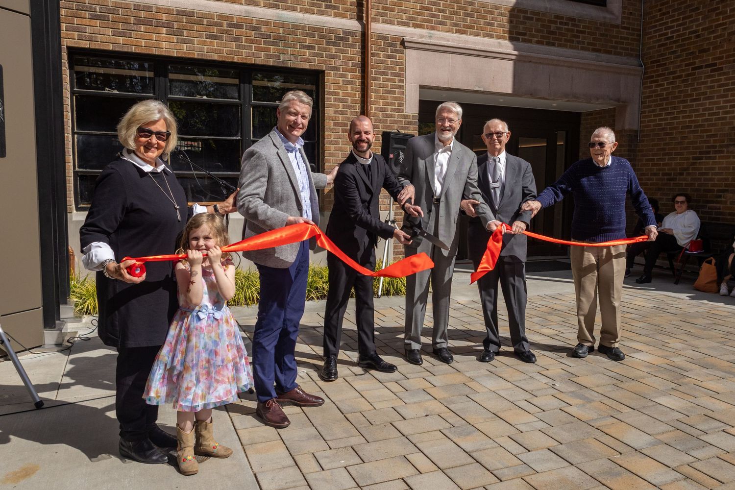 A ribbon-cutting building project celebration at a church in Seattle.