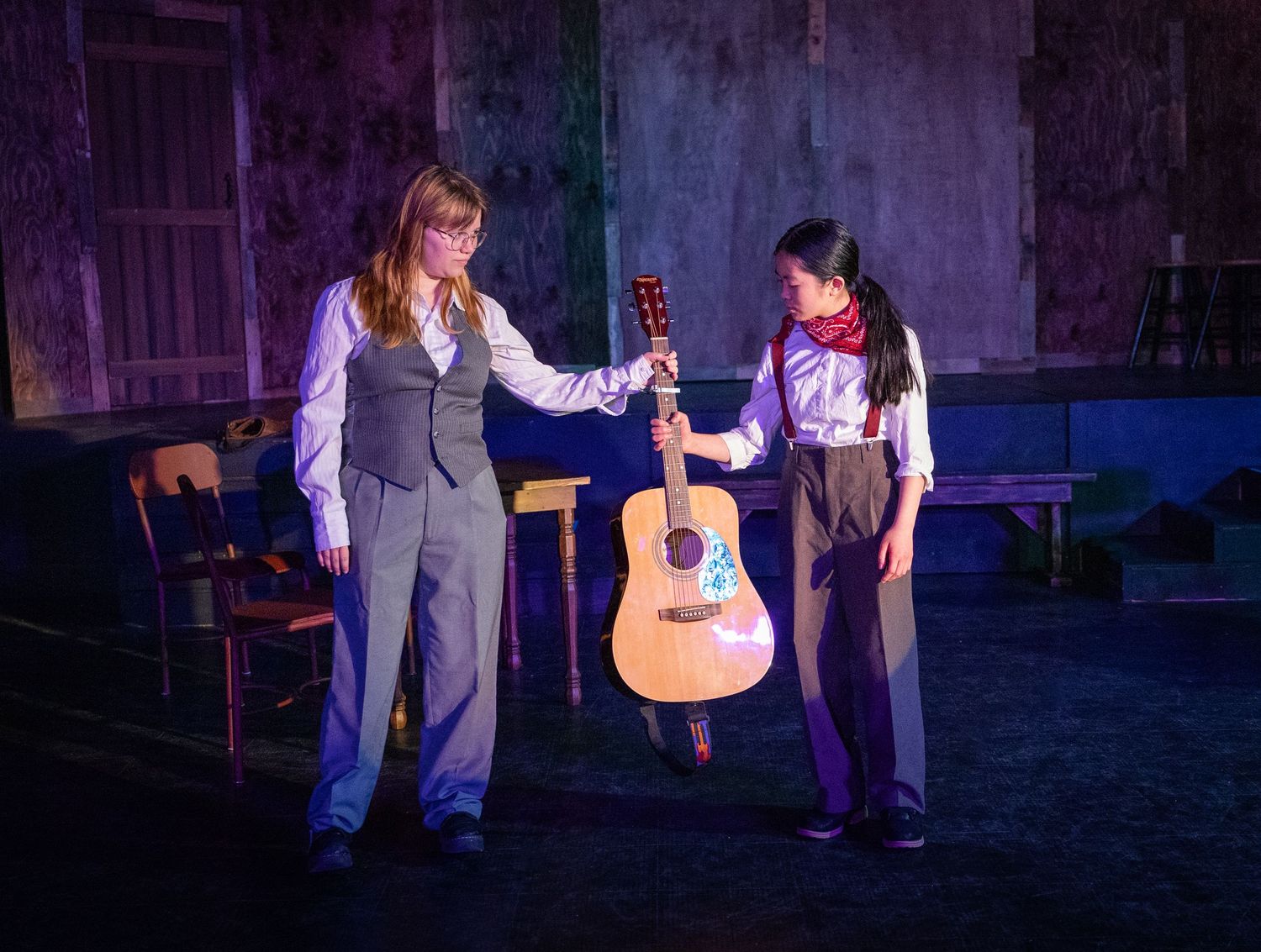 Stage scene with actors in character under lighting in Kirkland theatre