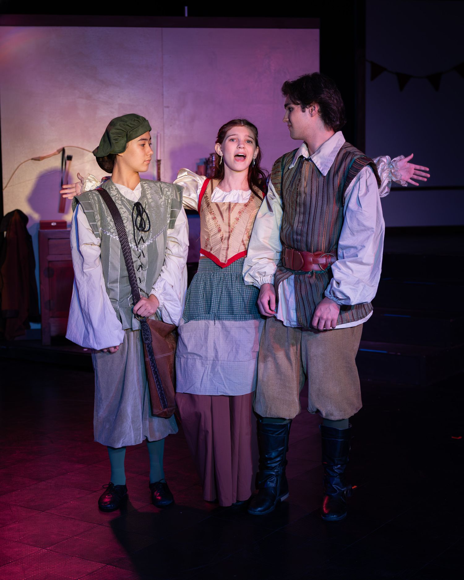 Actor performing on stage under theatrical lighting in Redmond
