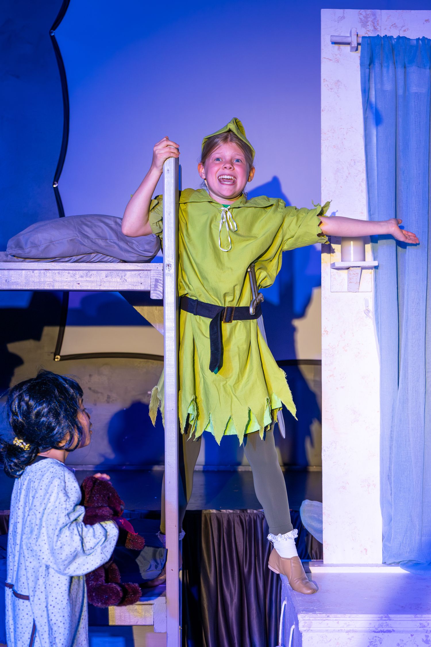 Youth actor expression captured during theatre performance in Redmond