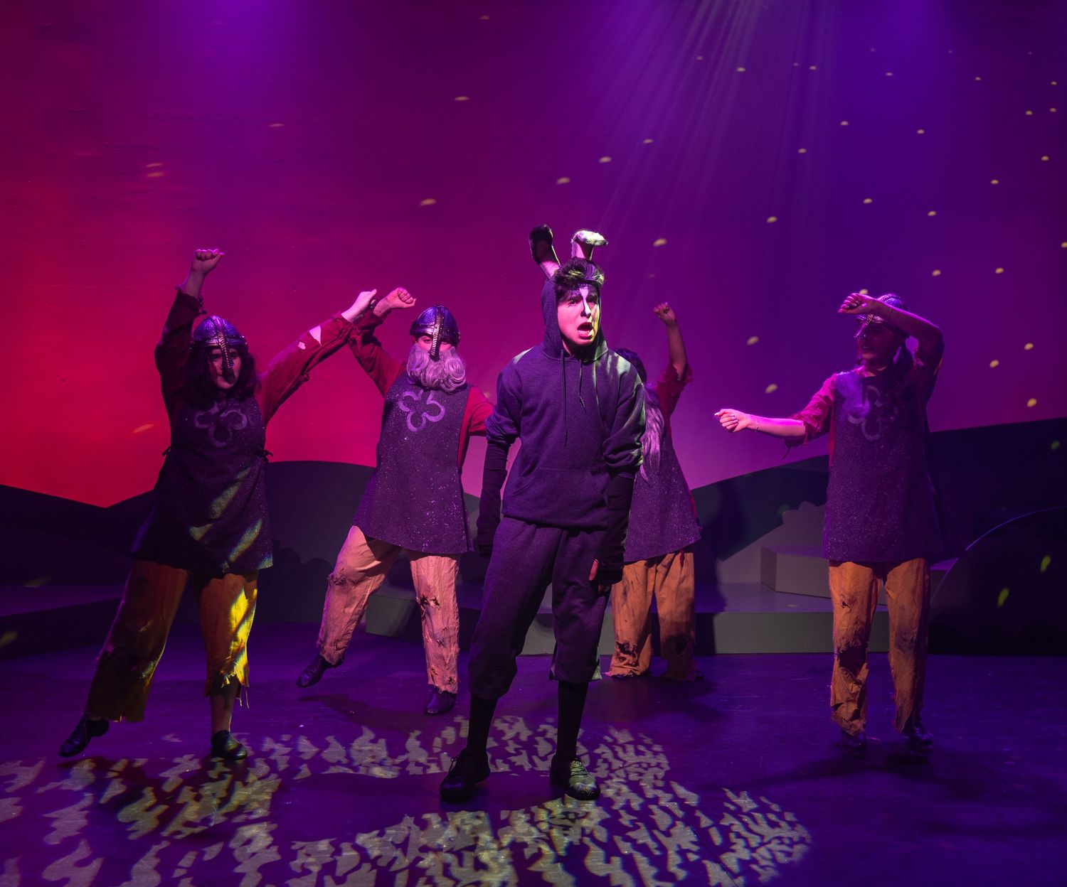 Teen actors performing in a comedic musical theatre production in Kirkland.