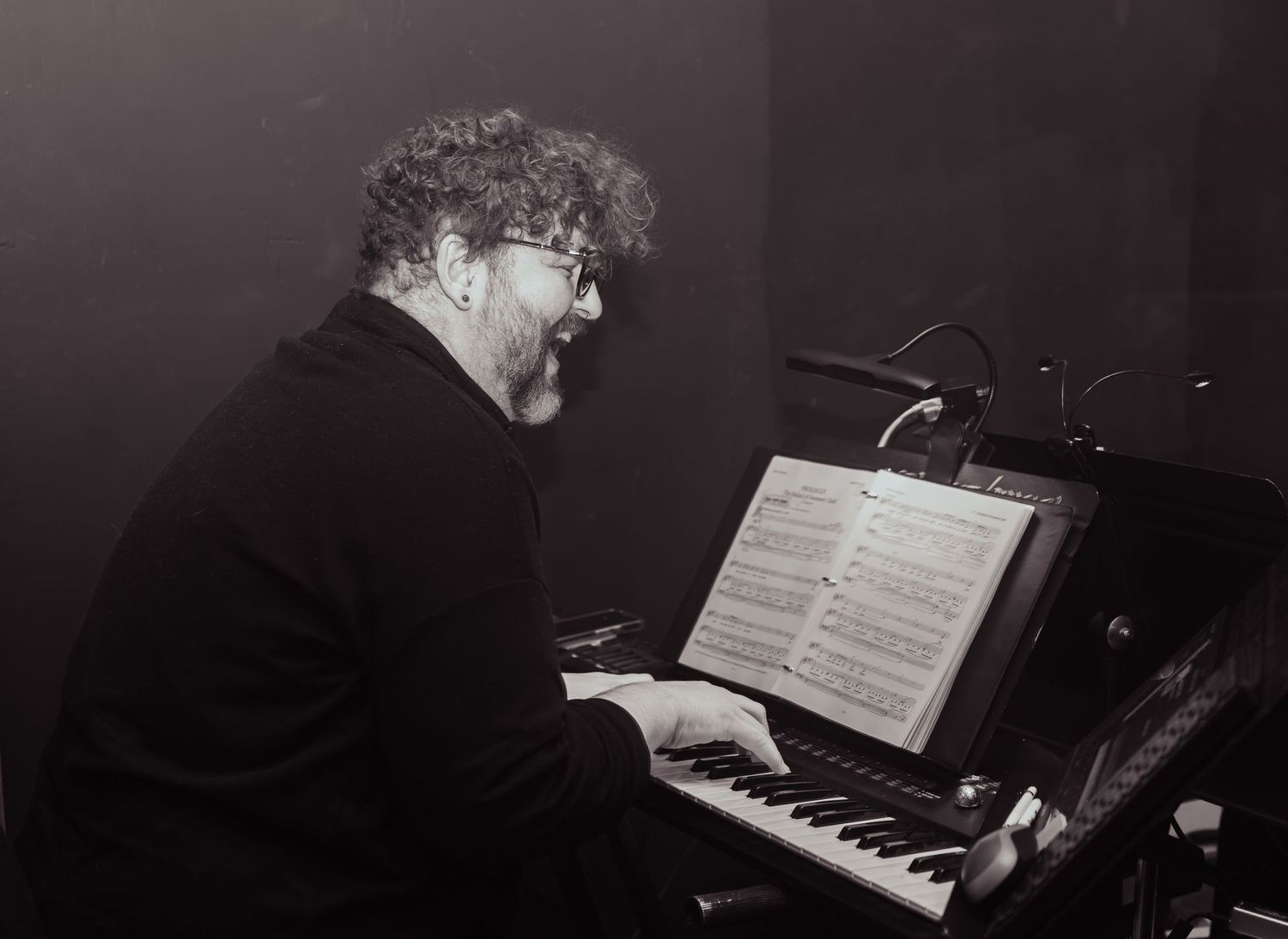 Musicians rehearsing scene on stage in Kirkland