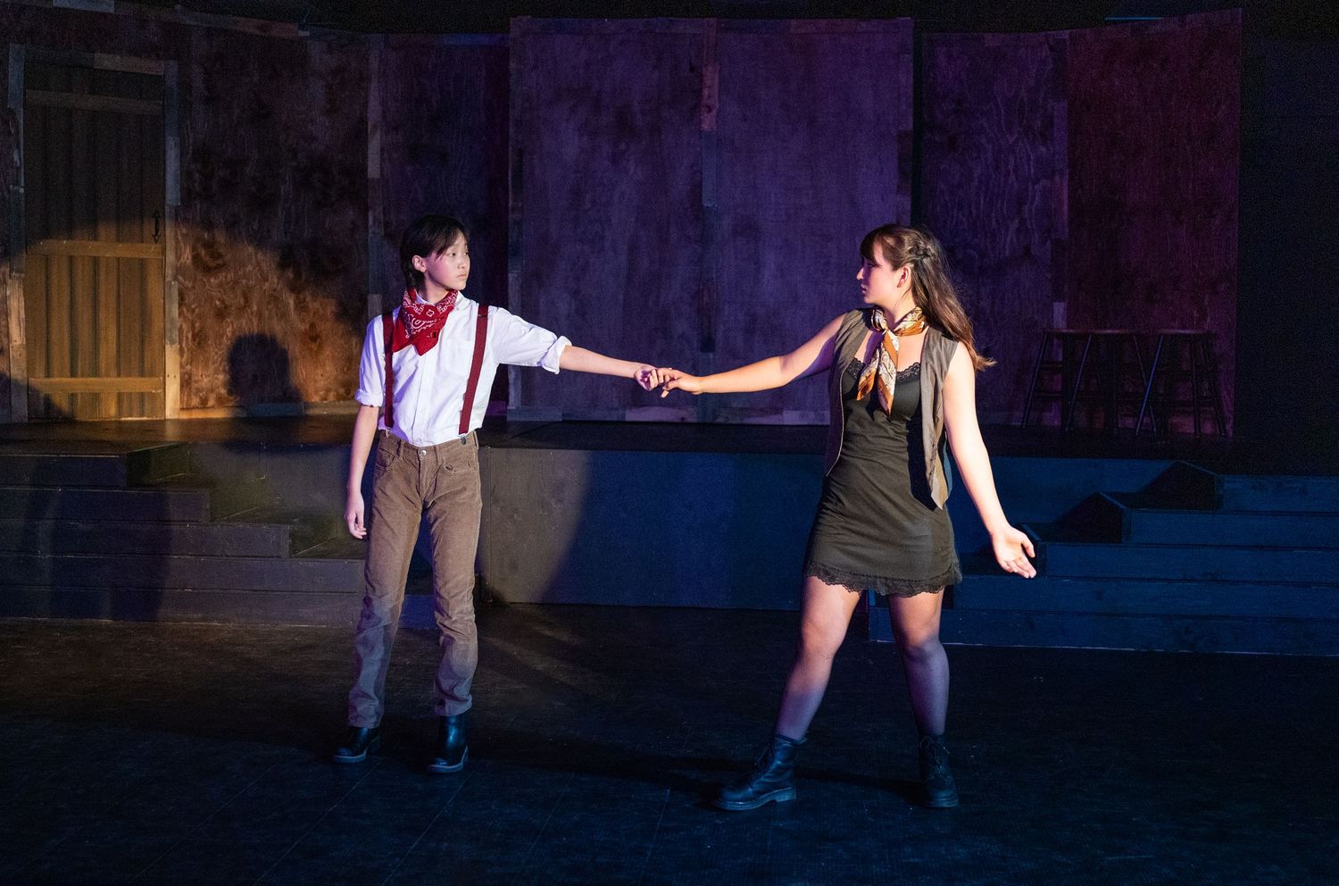 Actors rehearsing scene on stage in Redmond theatre