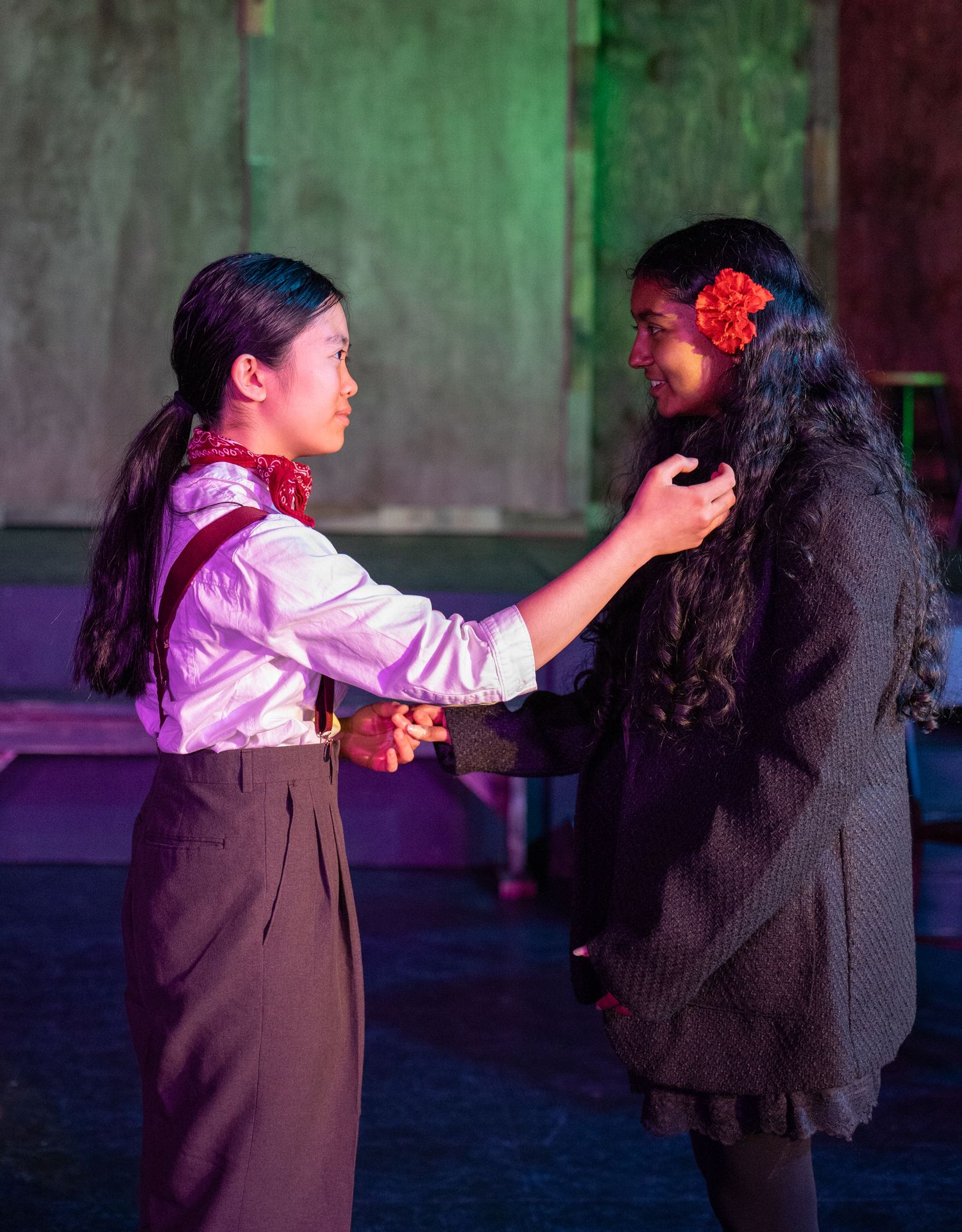 Actor mid-performance on stage in Redmond musical theatre