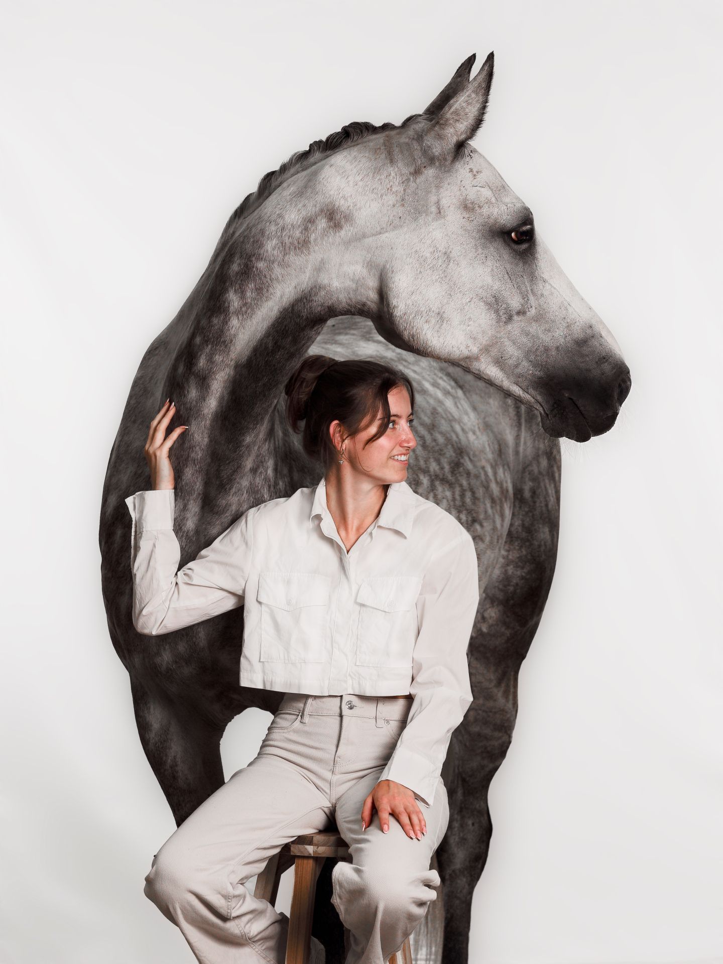 Artistic black and white photo series showing a person in white clothing posing with a dark horse against a light background.