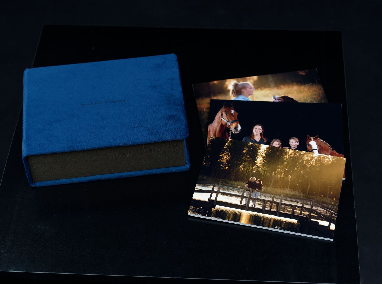 Dark photo album or portfolio with dramatic lighting effects.