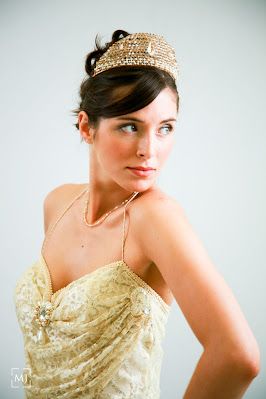 Elegant bridal portrait featuring sparkly gold crown and beaded dress.