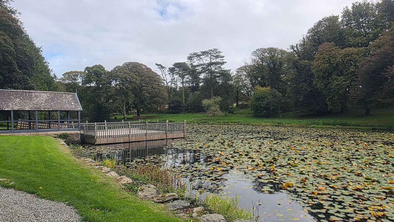 The lake, the boathouse and the water’s edge at Carreglwyd Estate