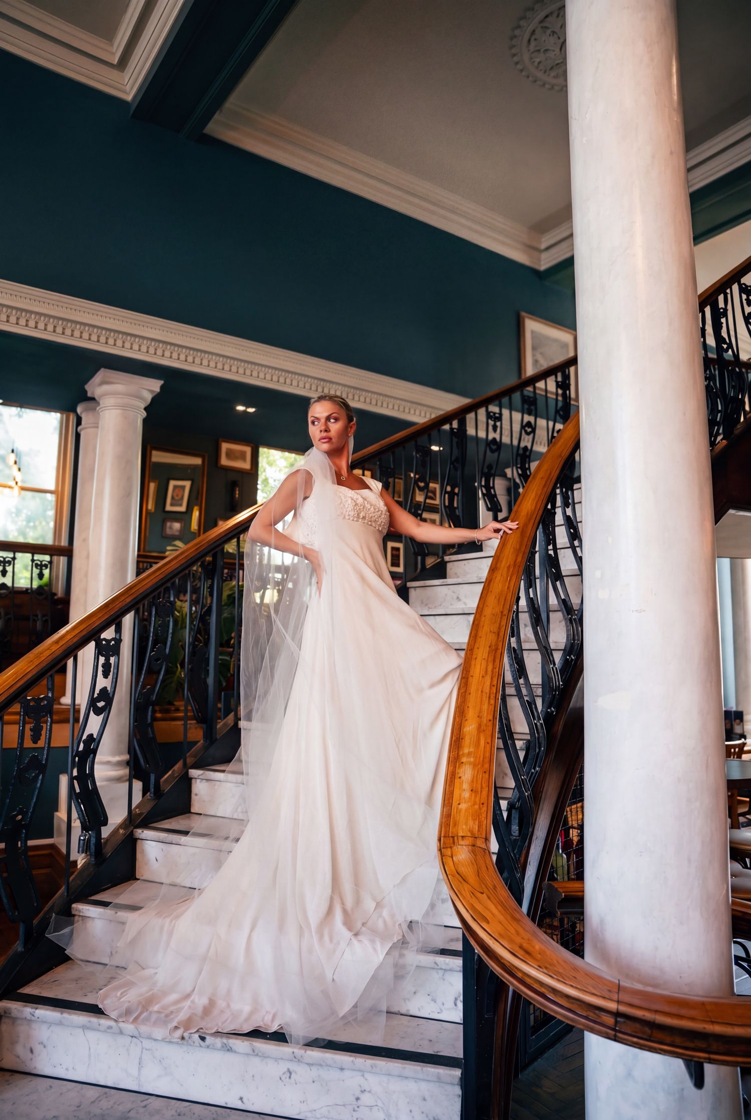 Bride in flowing blush wedding gown poses elegantly at The Barrow Boy and Banker captured by Martin Japheth Photography
