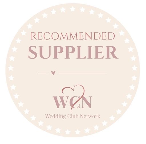 Oval shaped Wedding Club Network supplier badges with decorative star trim in cream color.