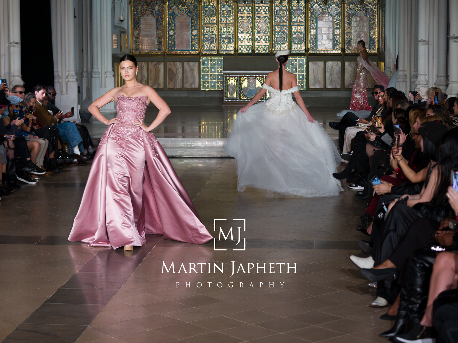 Fashion models present luxurious bridal collections on a runway with ornate architectural backdrop.