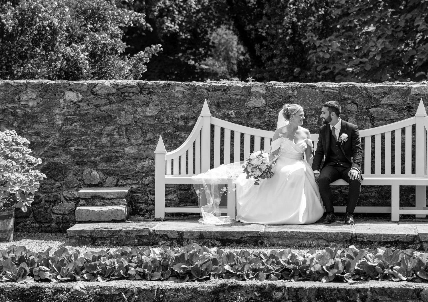 A signature portrait of Yasmin and Tom at the walled gardens of Plas Cadnant, captured by Martin Japheth Photography