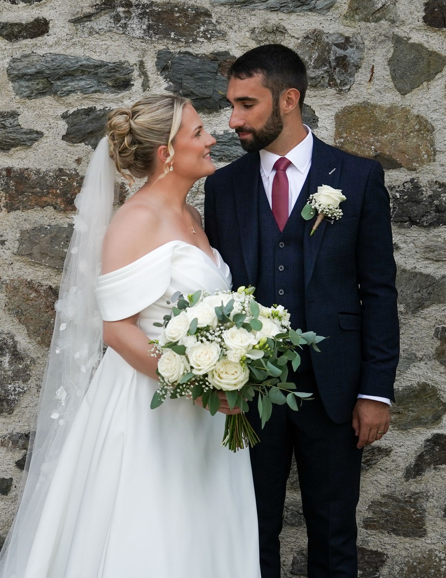Bridal bouquet and dress detail at an Anglesey wedding by North Wales photographer Martin Japheth