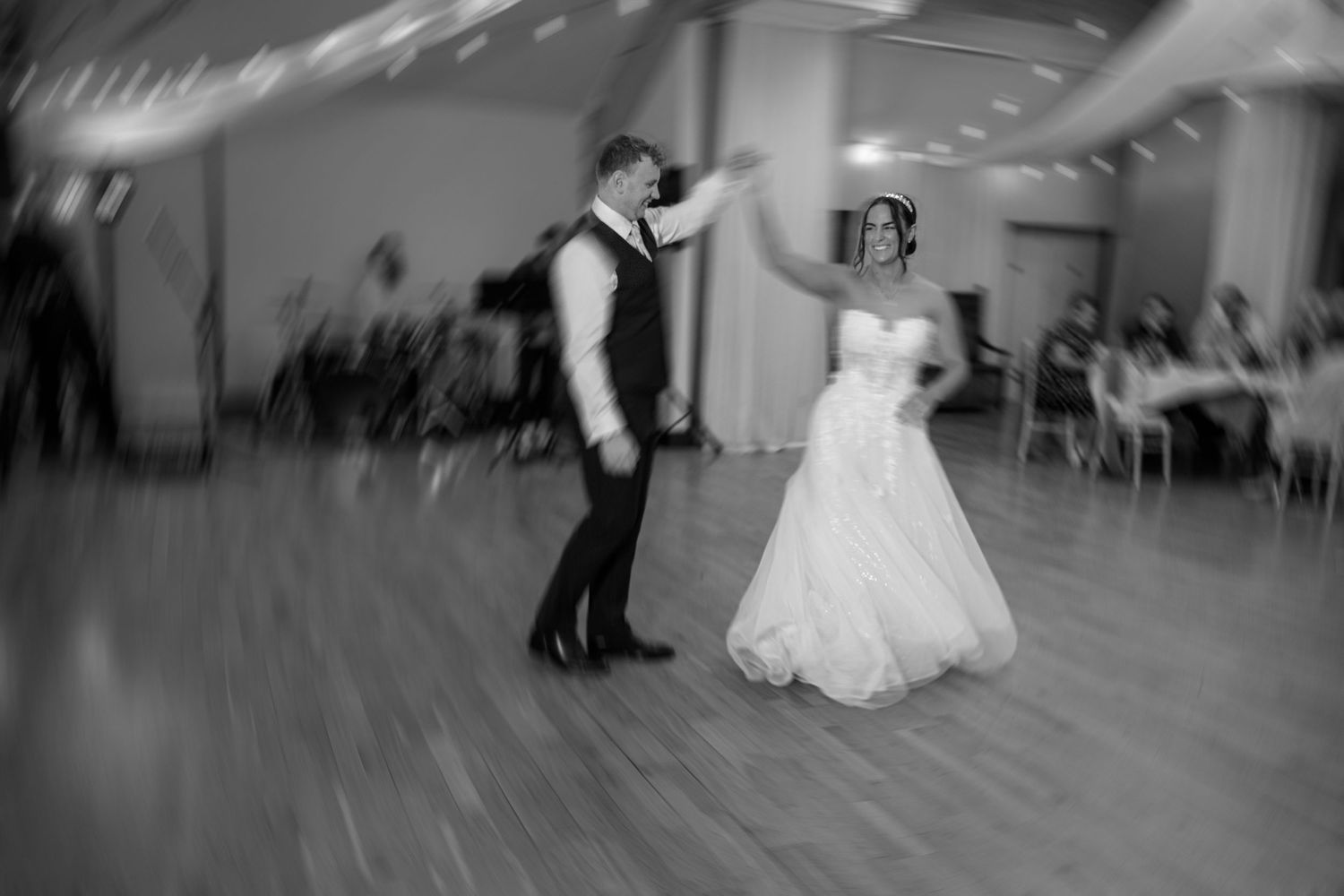 Bride in a white gown and groom during their first dance at Nant Gwrtheyrn reception.