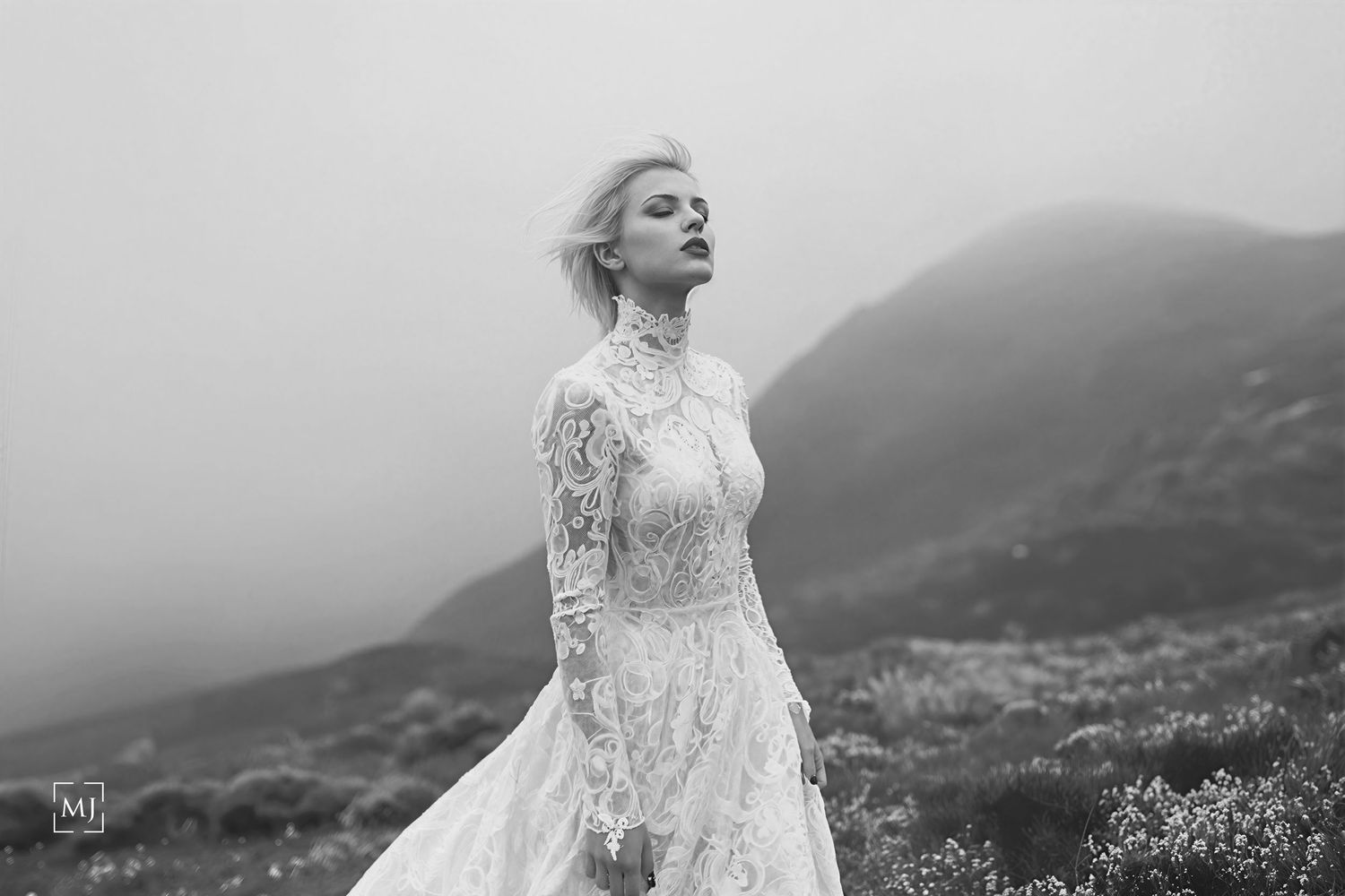 Ethereal bridal portrait in black and white with Llithfaen mountains and fog in the background. Wedding Photographer Martin Japheth