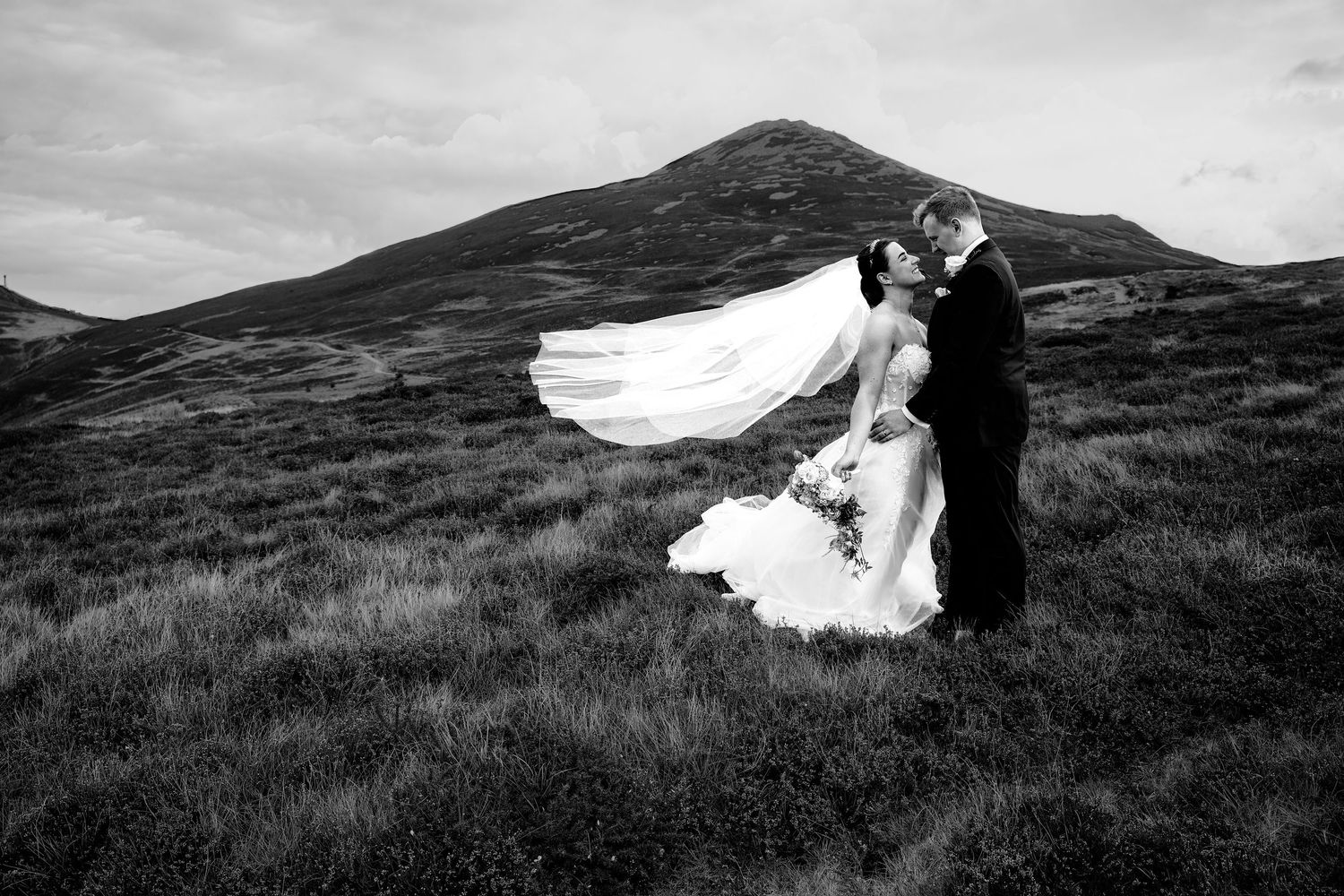 Bride and Groom in a wild mountain landscape at Nant Gwrtheyrn shot during Signature time.