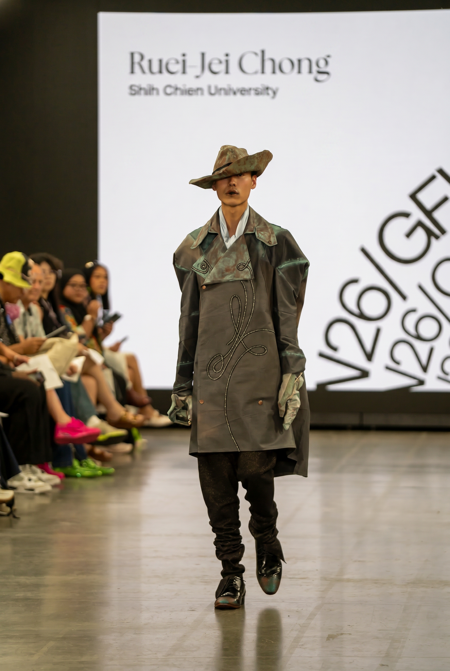 Ruei Jei Chong's avant-garde gray coat and hat ensemble at Shih Chien University fashion show. Martin Japheth Photography