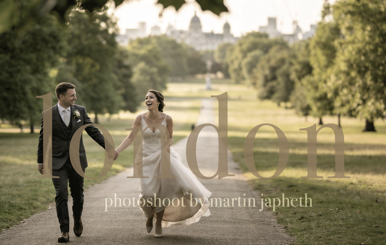 Bride and groom walking hand in hand in a lush London park, wedding photo by Martin Japheth.
