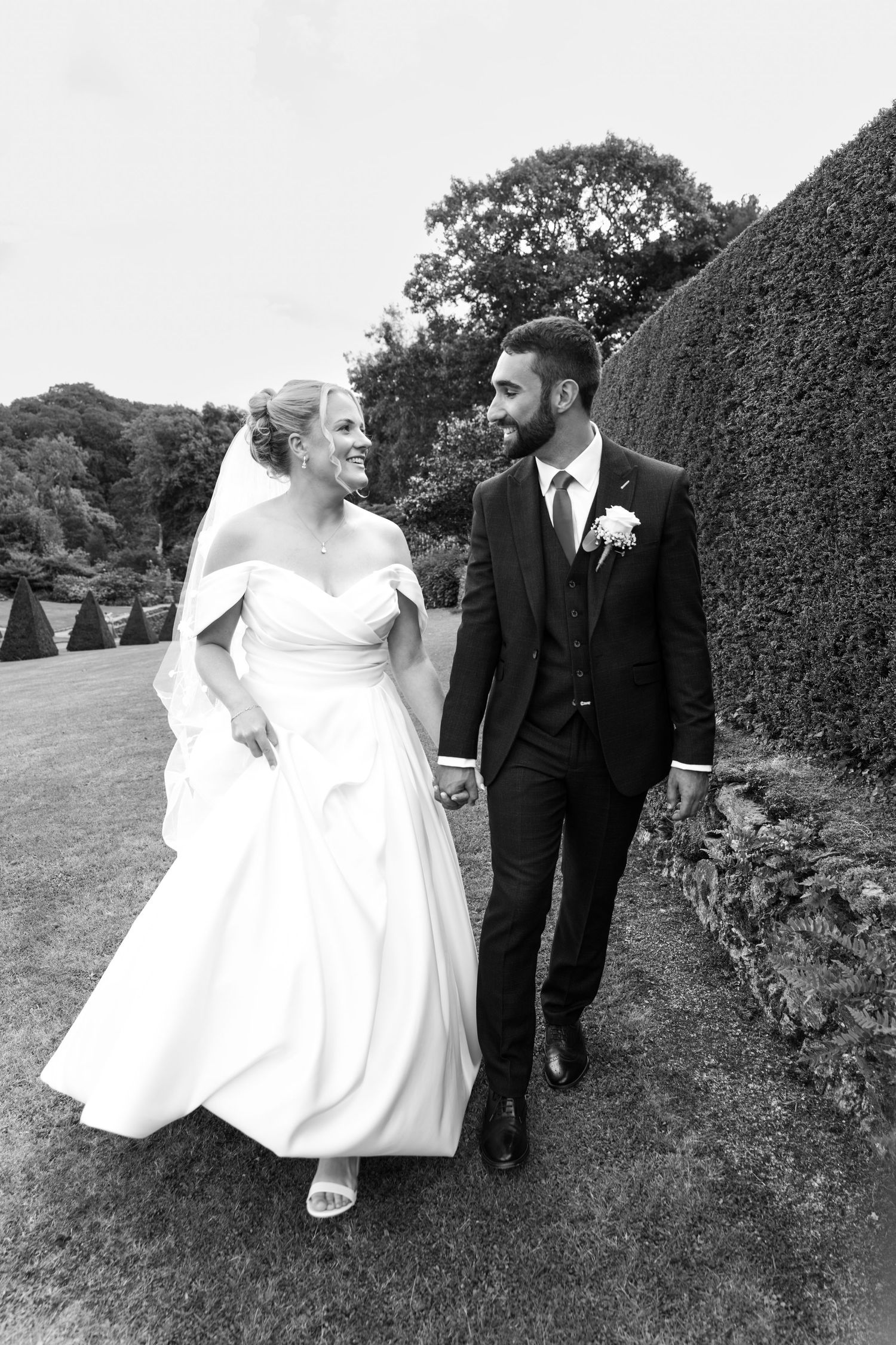 Bride and groom in the walled garden at Plas Cadnant Hidden Gardens, Anglesey with Martin Japheth Photography