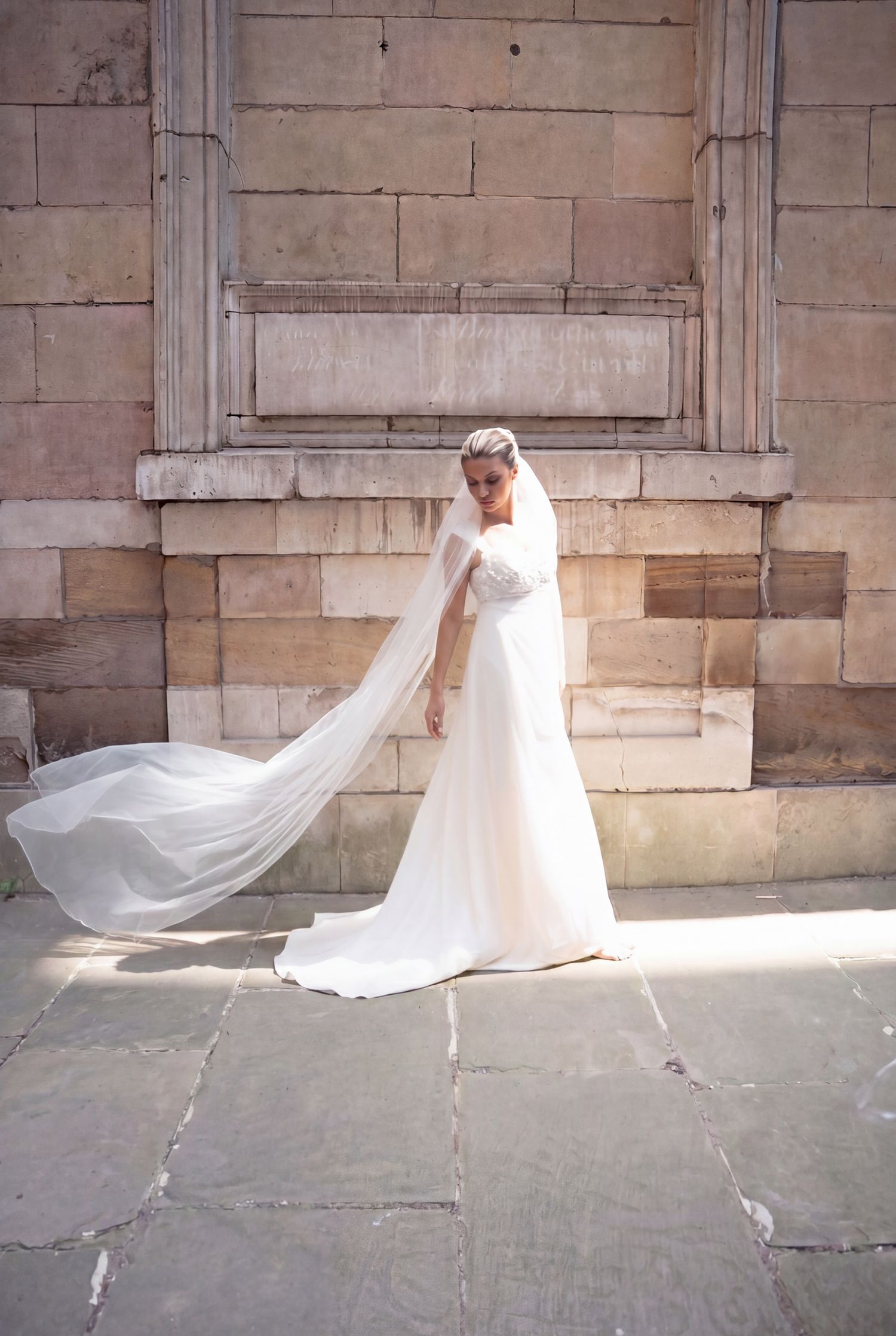 Bride's veil in motion at St Dunstan in the East church garden, London bridal portrait