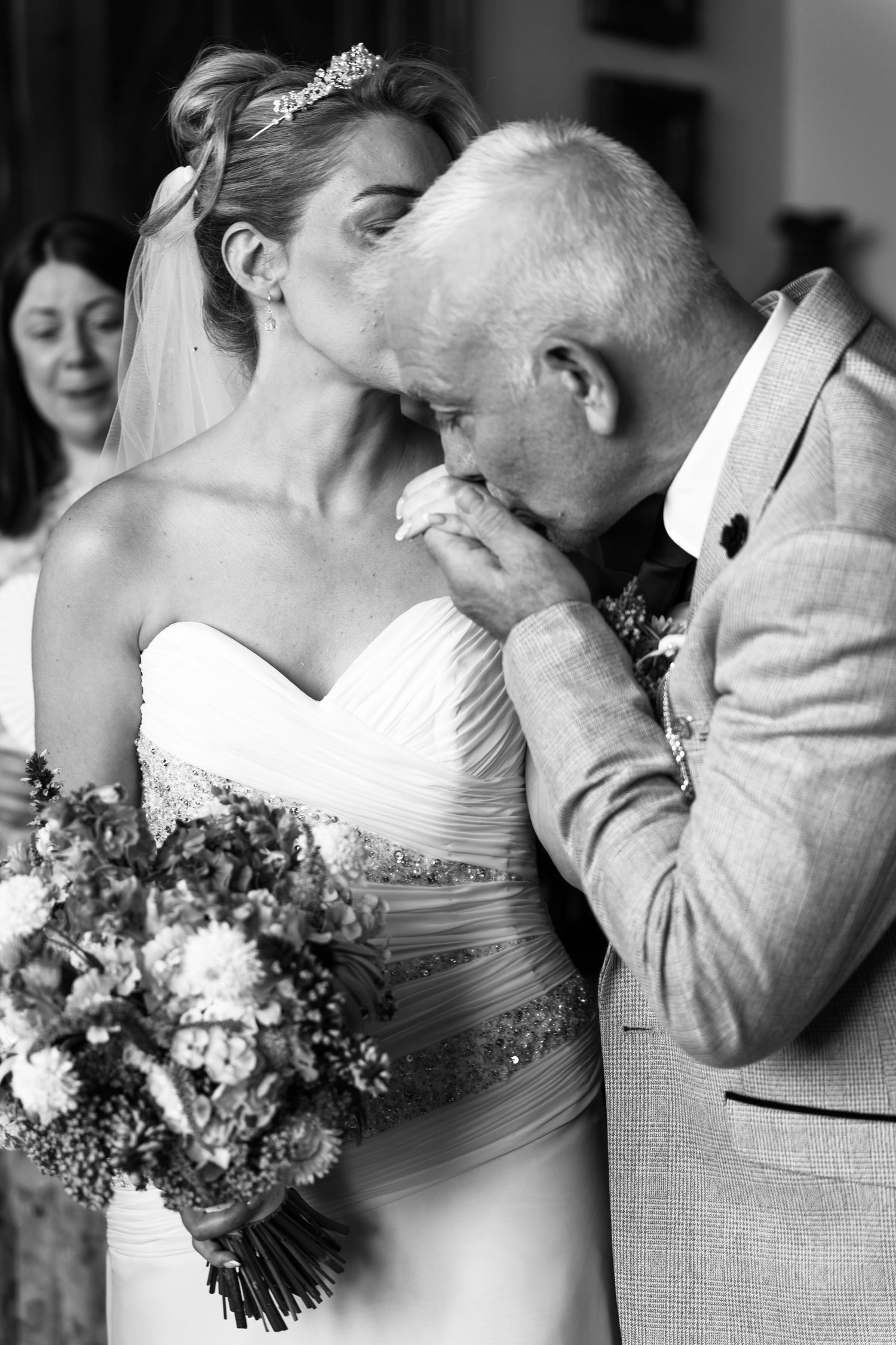 Black and white wedding photo Bride and her father during the ceremony at Chateau Rhianfa on Anglesey.