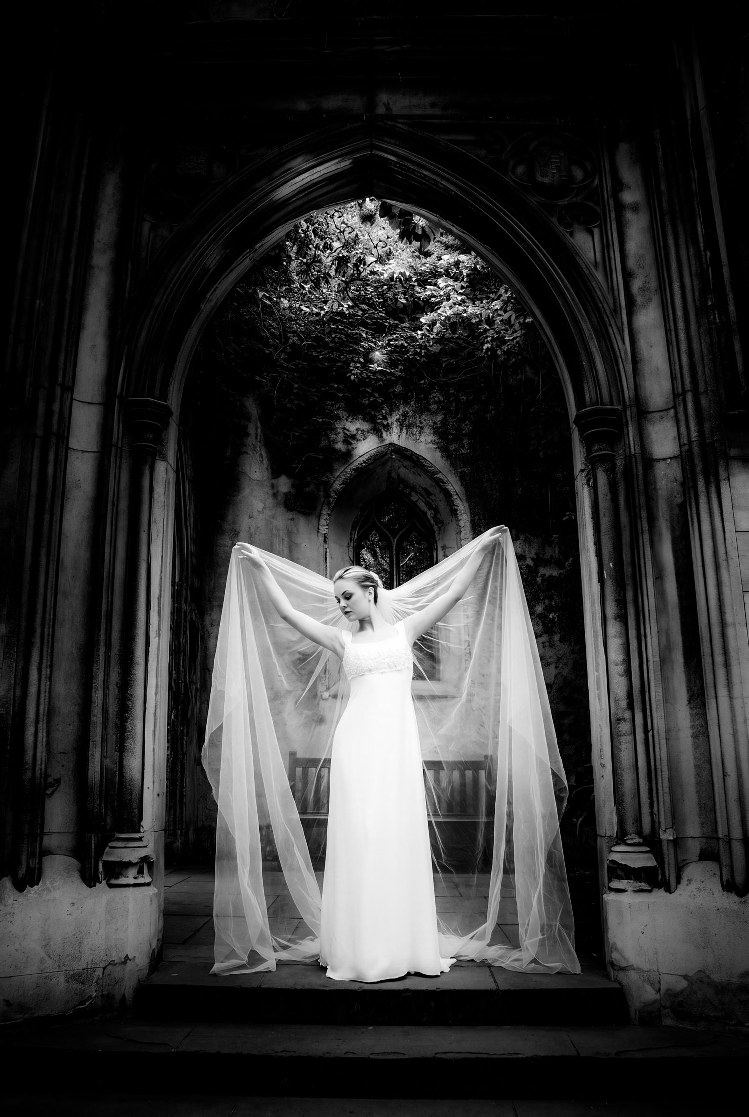 Bride's veil in motion at St Dunstan in the East church garden, London bridal portrait captured by Martin Japheth Photography