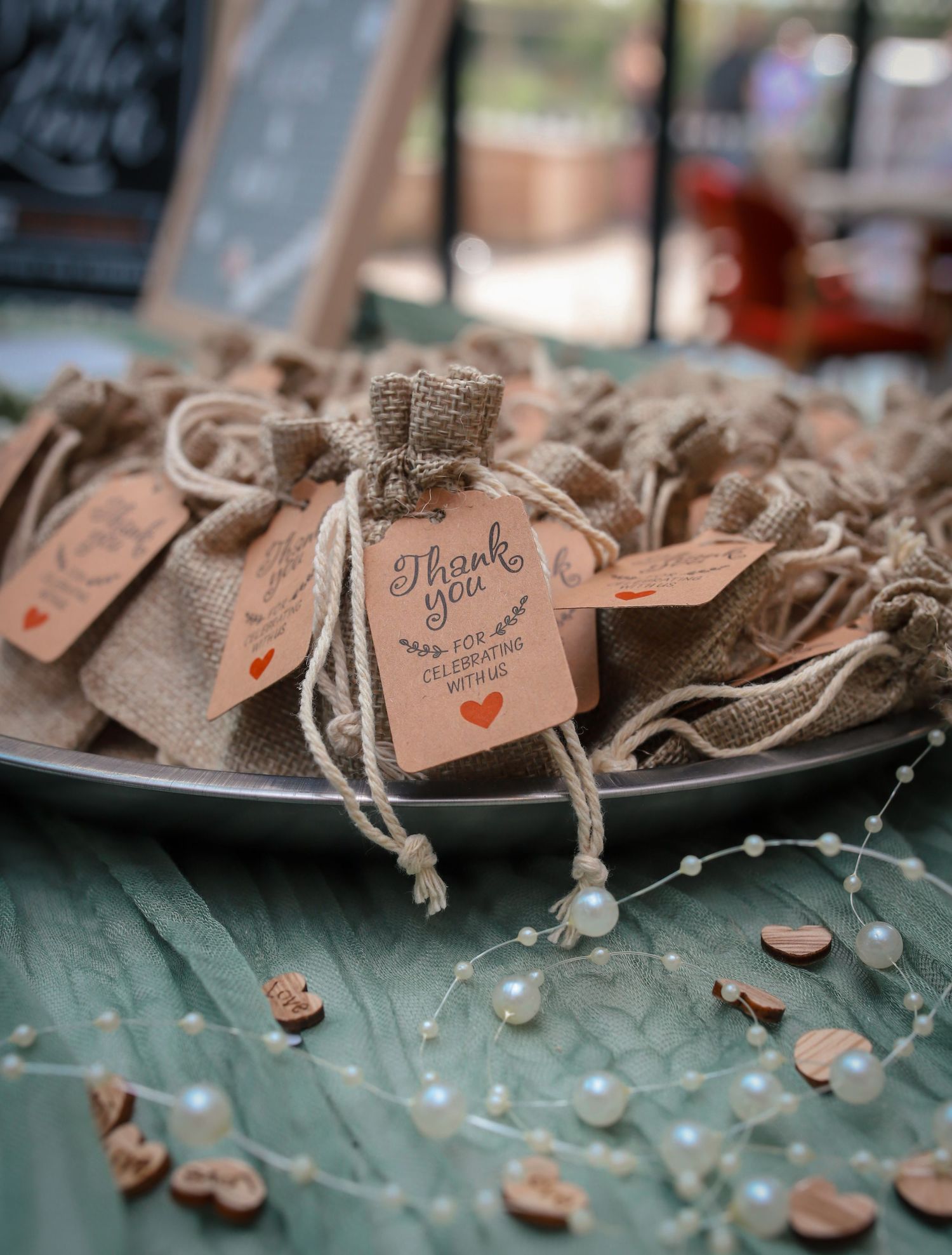 Rustic wedding favor tags with twine and burlap details.