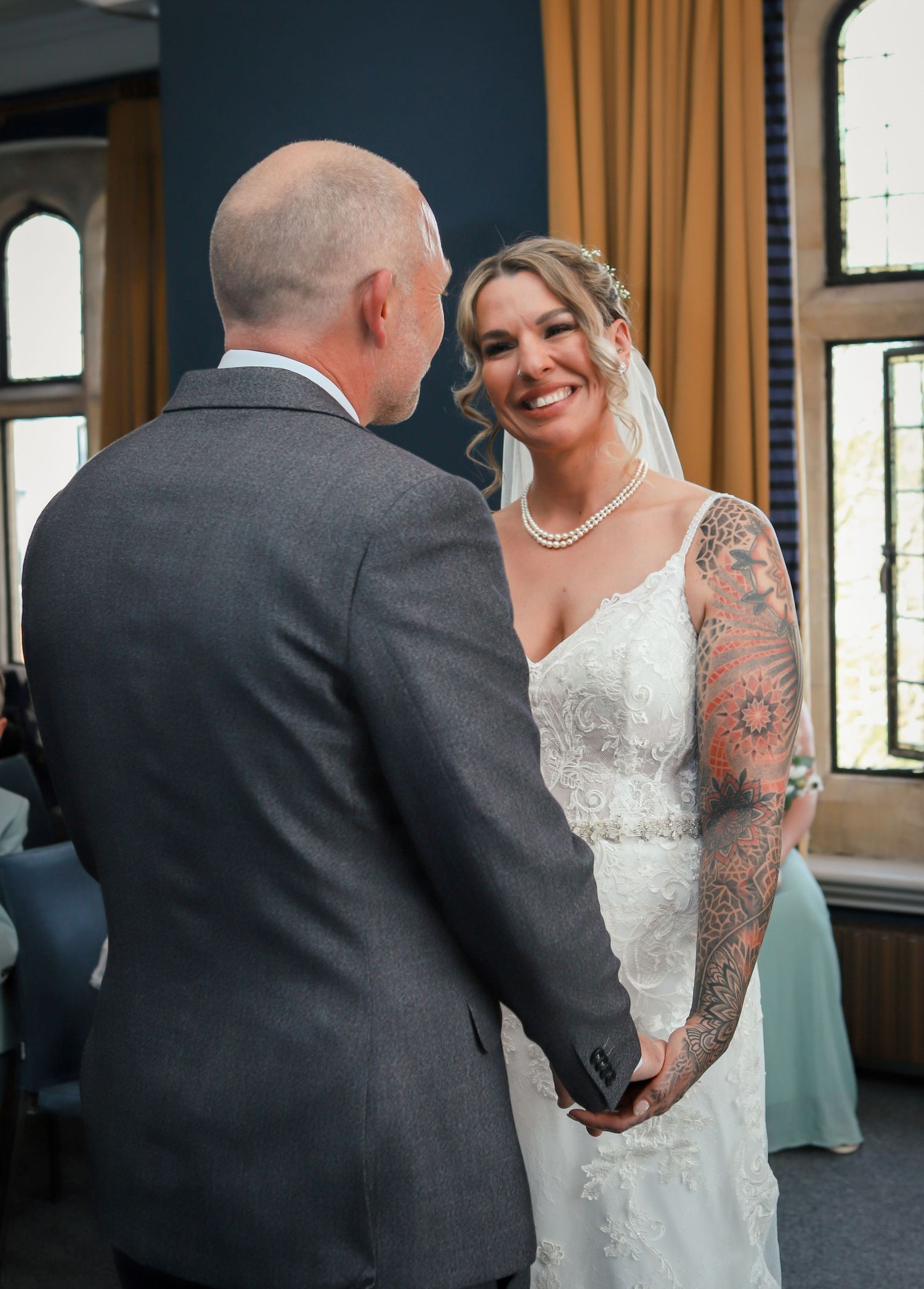 Candid wedding couple interaction showing playful emotions and laughter.