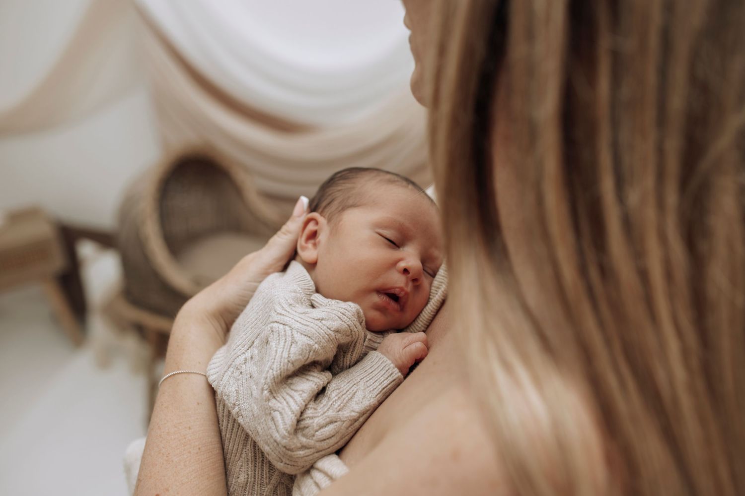 Intimate lifestyle photography session with soft neutral tones and natural lighting.