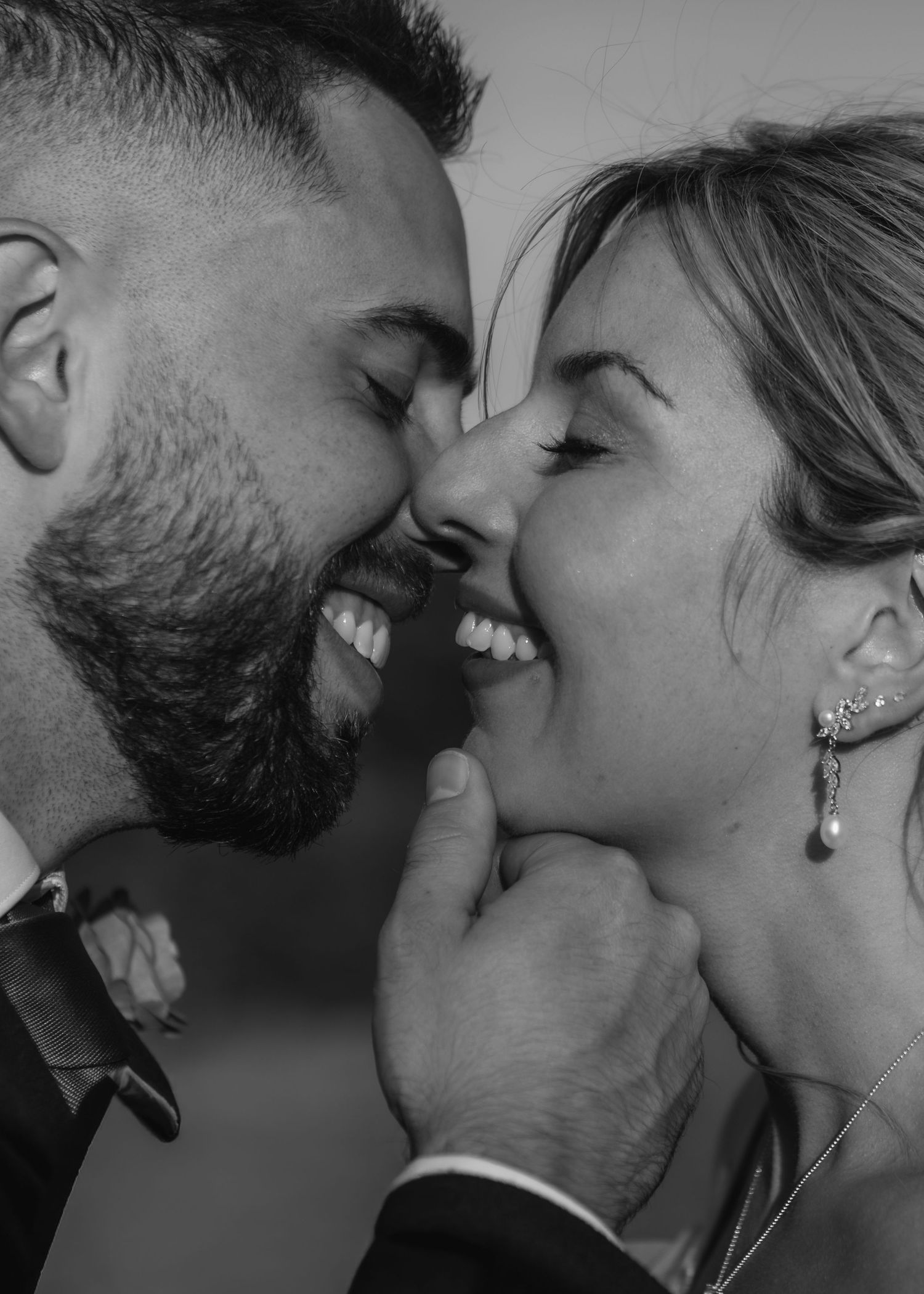 An intimate black and white close-up of a tender romantic moment.