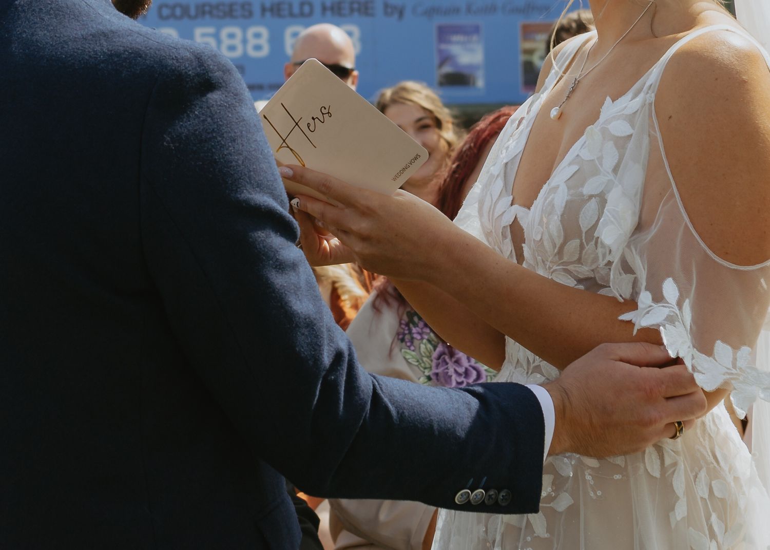 Close-up of wedding ceremony details with rings and vows.