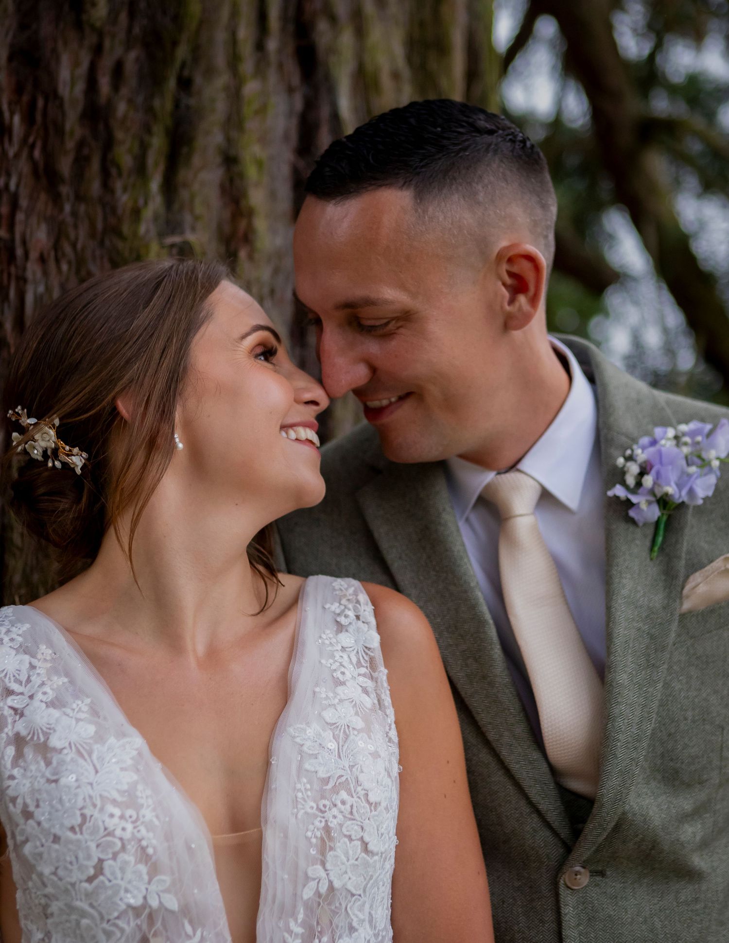 An intimate moment between newlyweds sharing a romantic close-up pose.